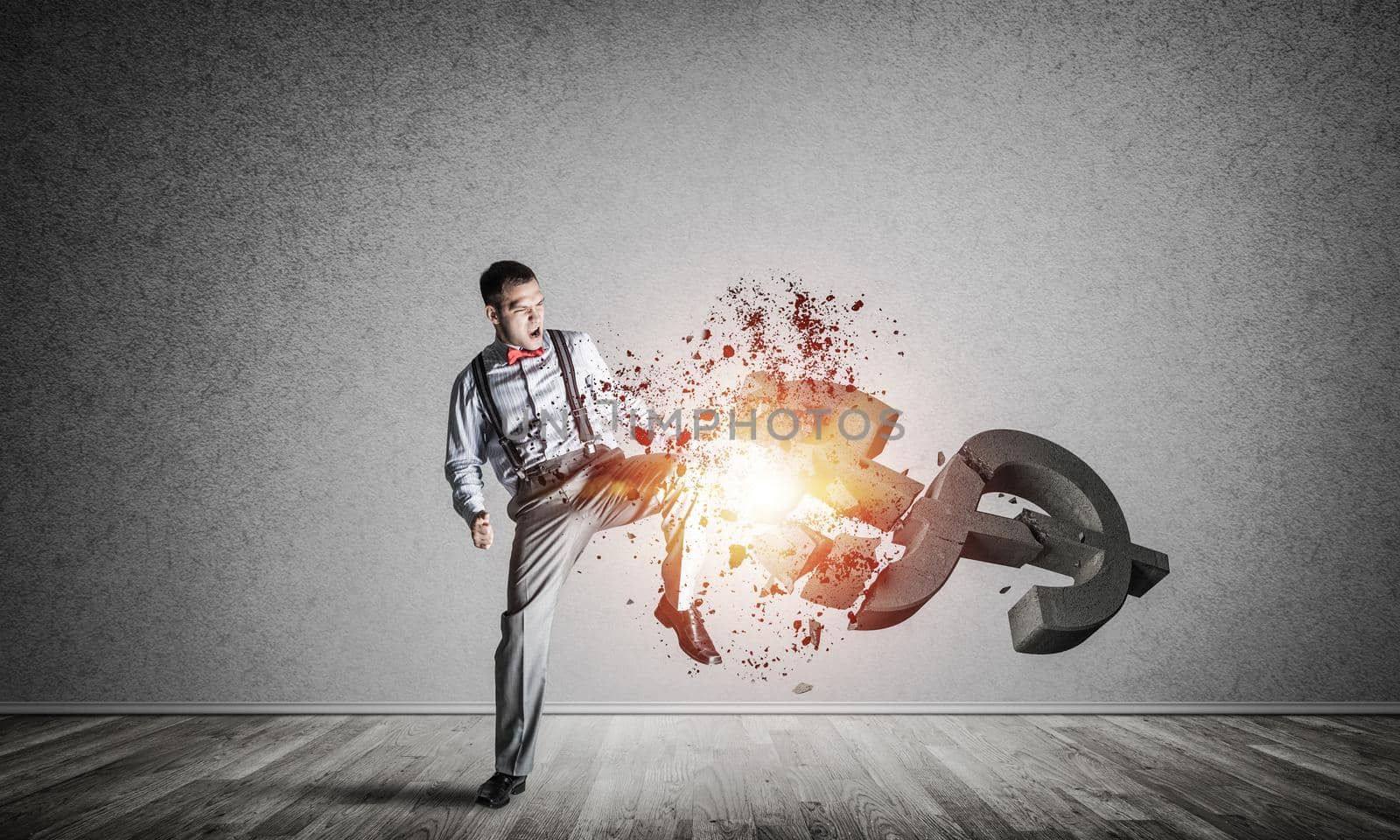 Young furious businessman in empty room crash with leg kick stone dollar symbol