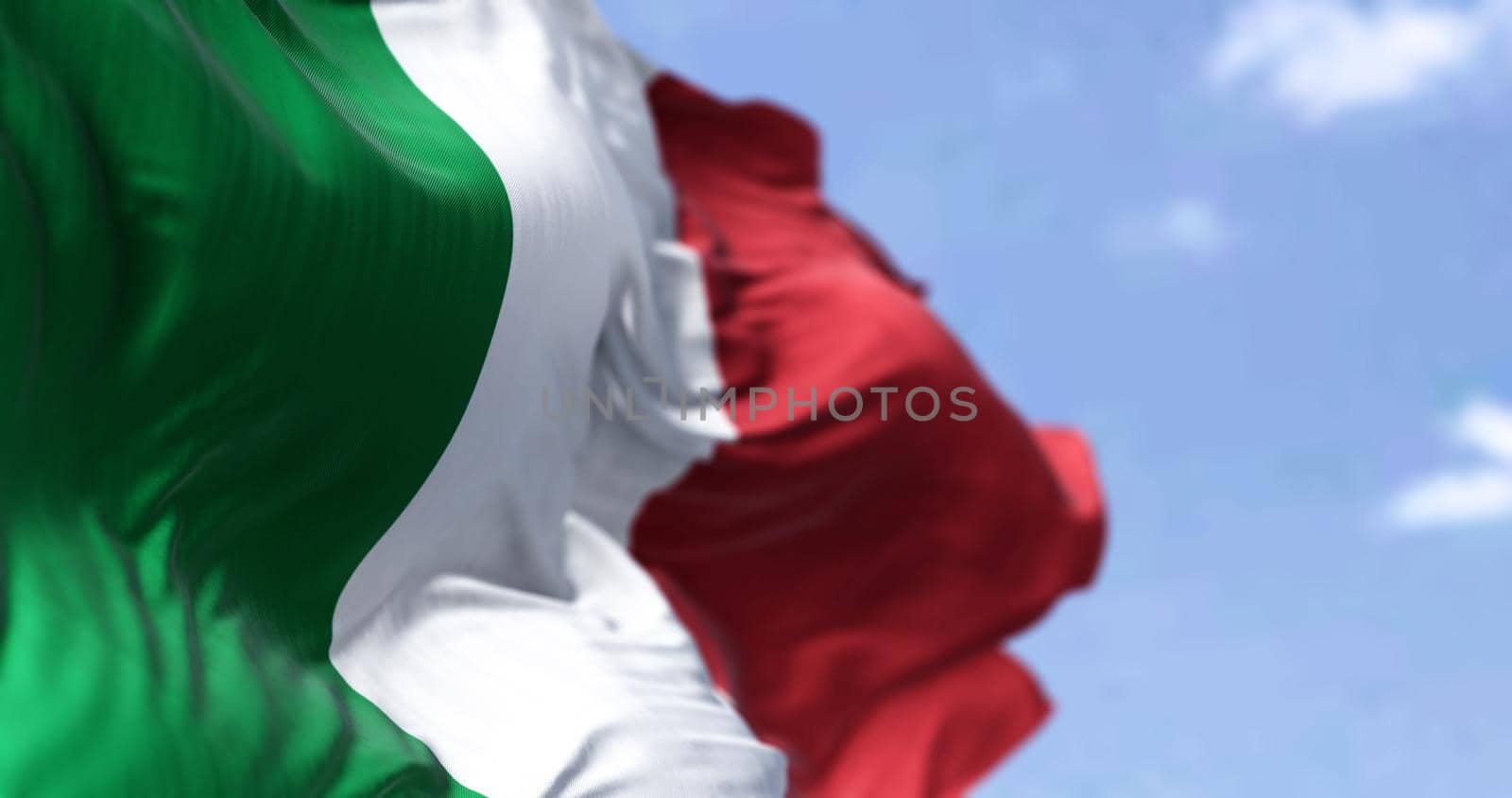 Detail of the national flag of Italy waving in the wind on a clear day by rarrarorro