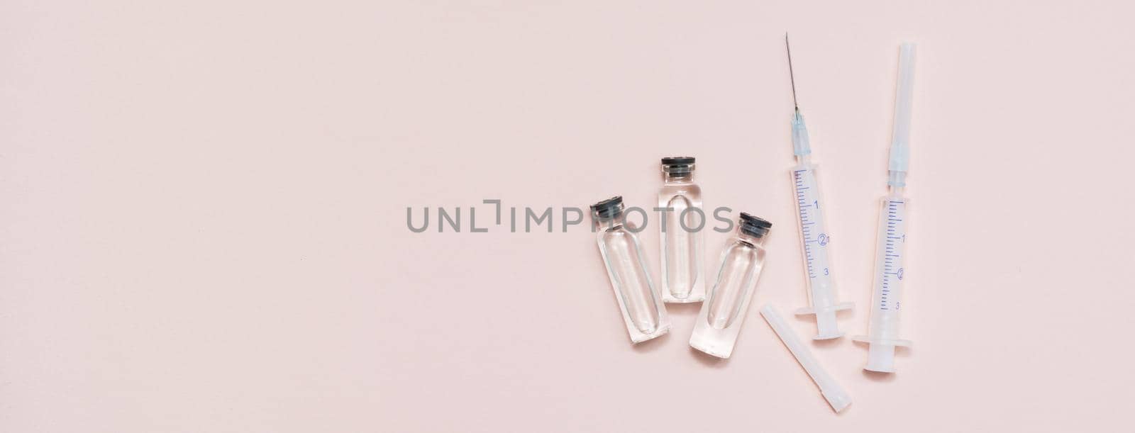Vaccination and Immunization. Vaccine vials and clean syringes. Top view. Copy space. Web banner