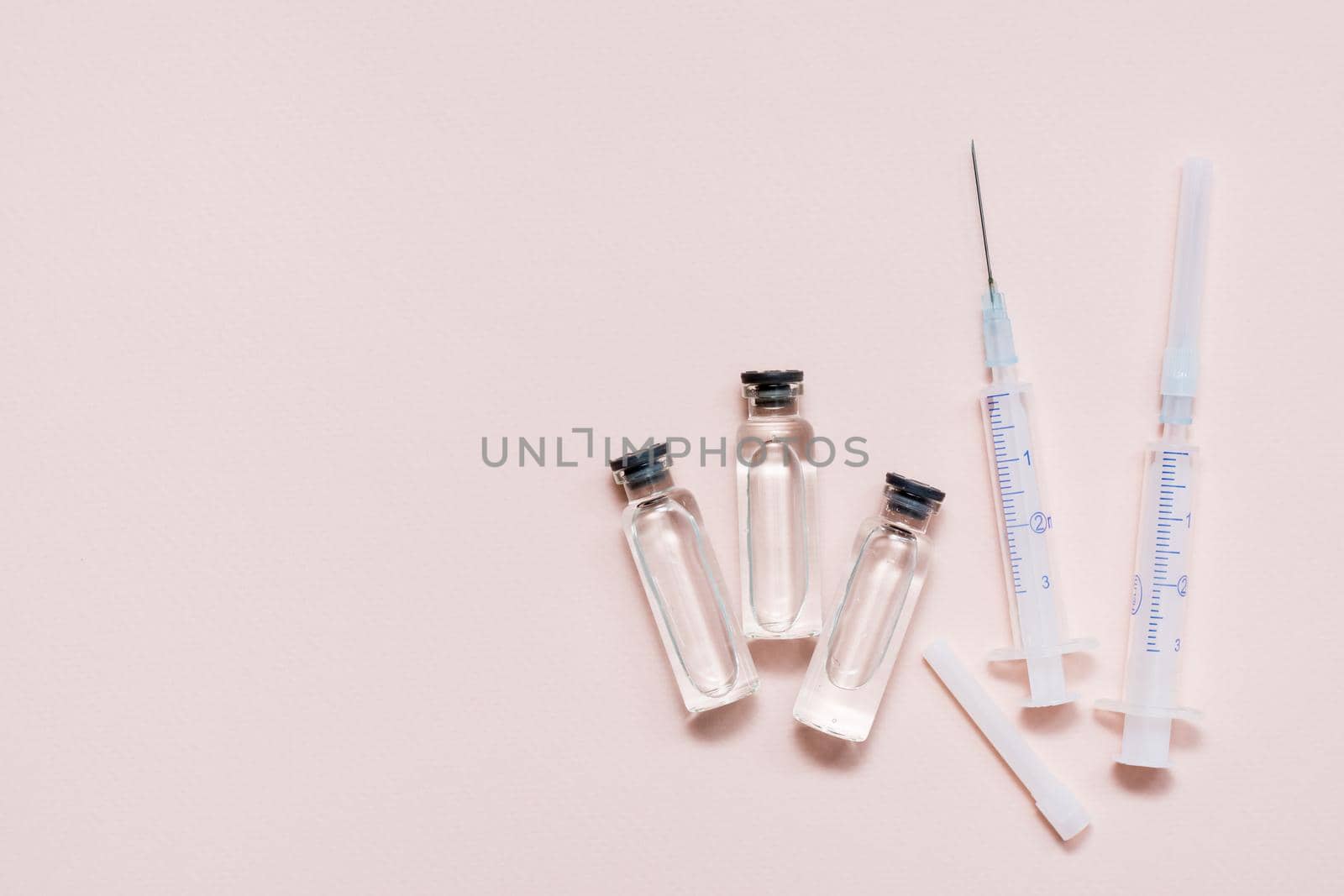 Vaccination and Immunization. Vaccine vials and clean syringes. Top view. Copy space by Aleruana