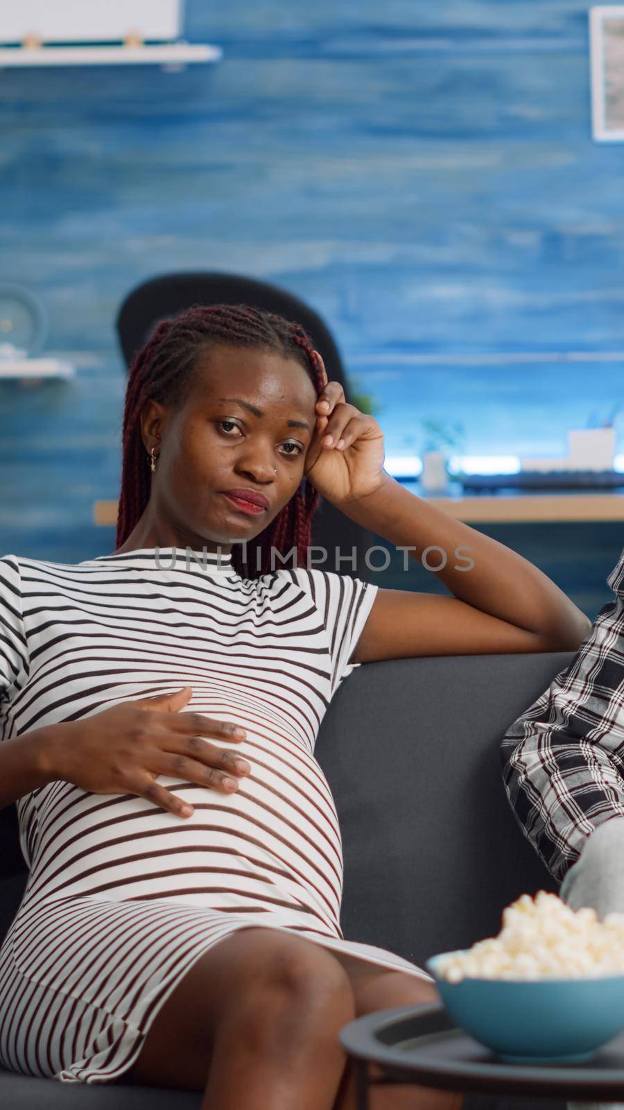 African american couple expecting child and using video call by DCStudio