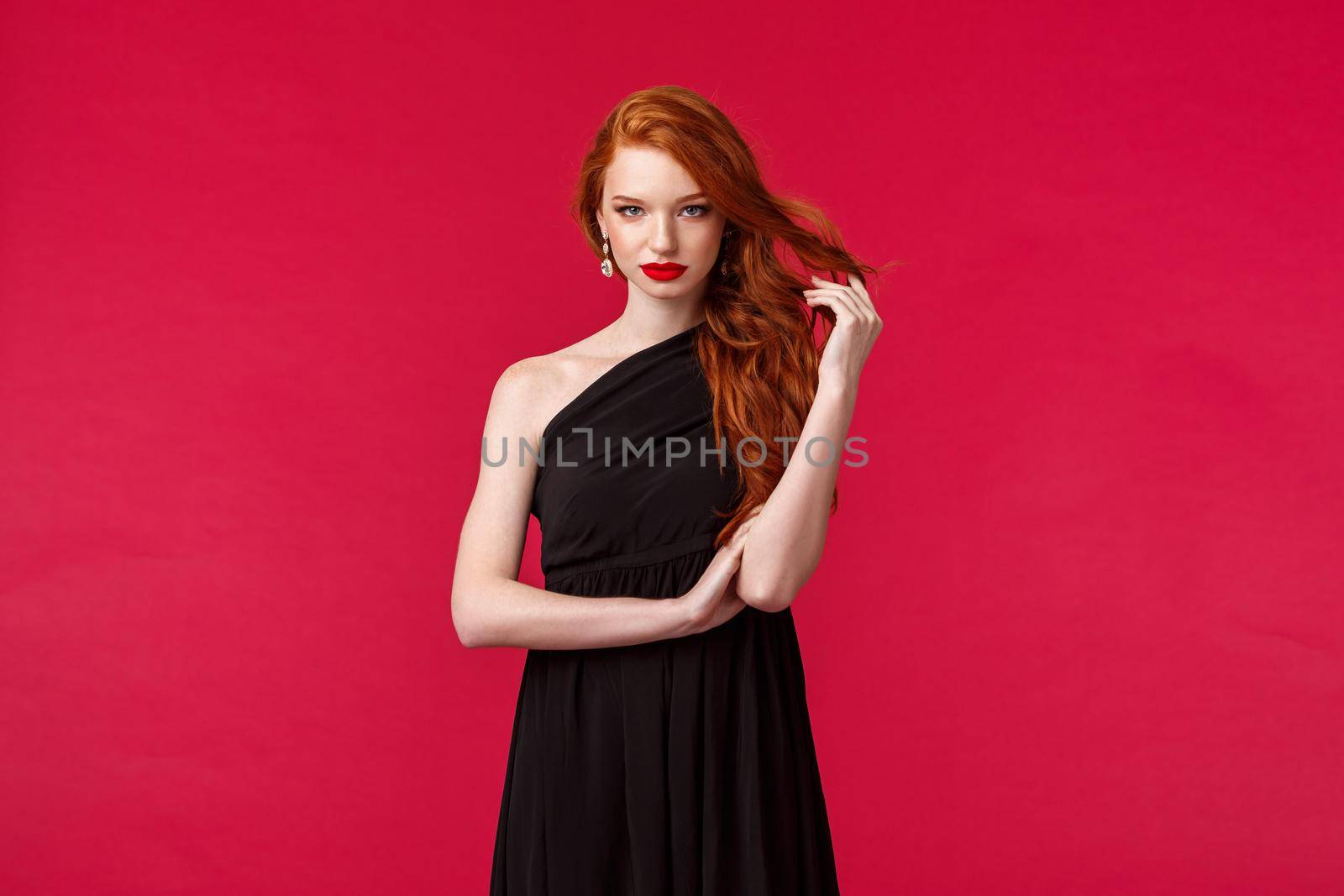 Elegance, fashion and woman concept. Seductive gorgeous redhead woman in black fashionable dress, attend formal event, party or prom, look assertive and determined, know what she wants.