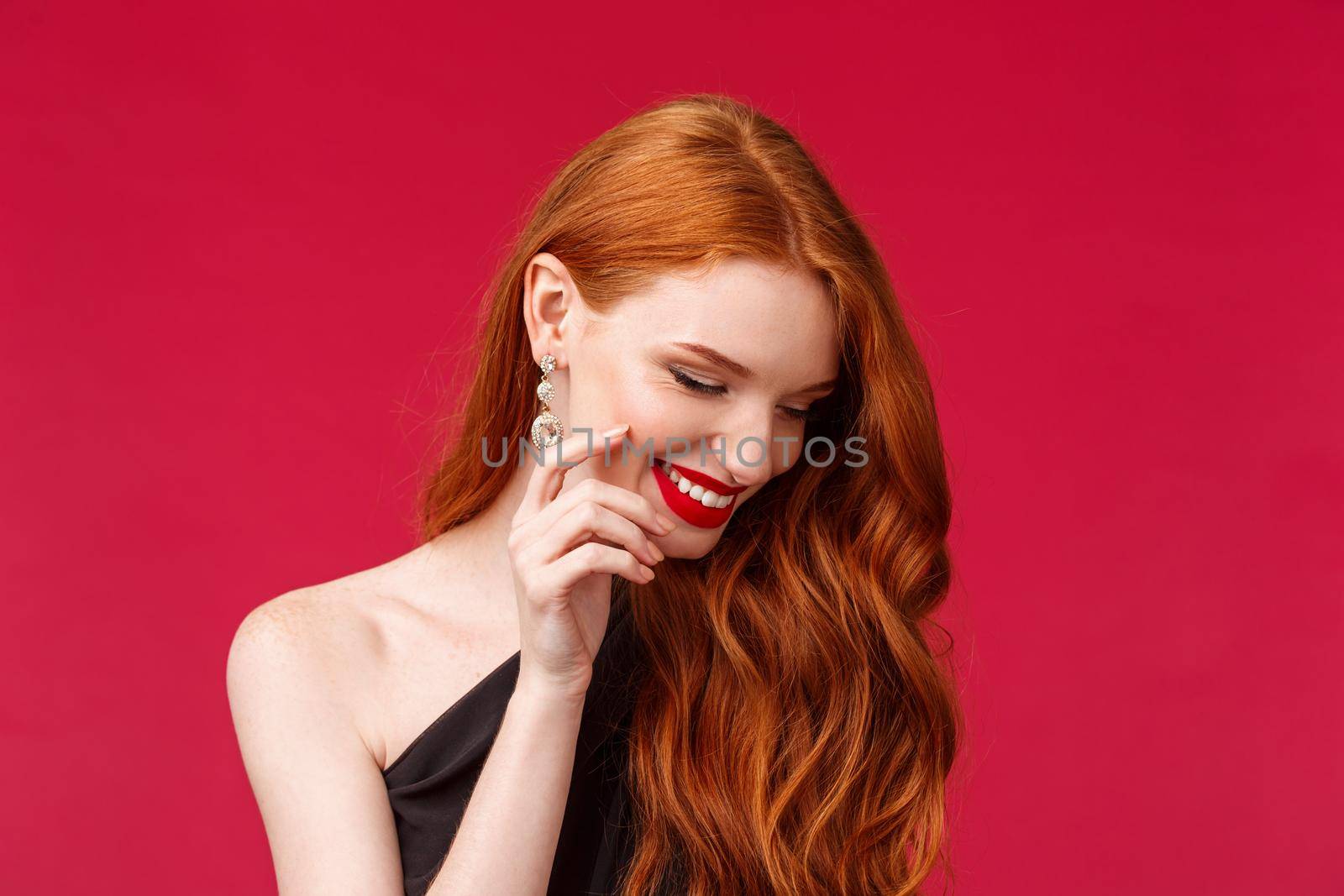 Elegance, beauty and fashion concept. Close-up portrait of coquettish redhead pretty woman blushing, giggle and look away shy as flirting with someone, have romantic date, wear earrings.