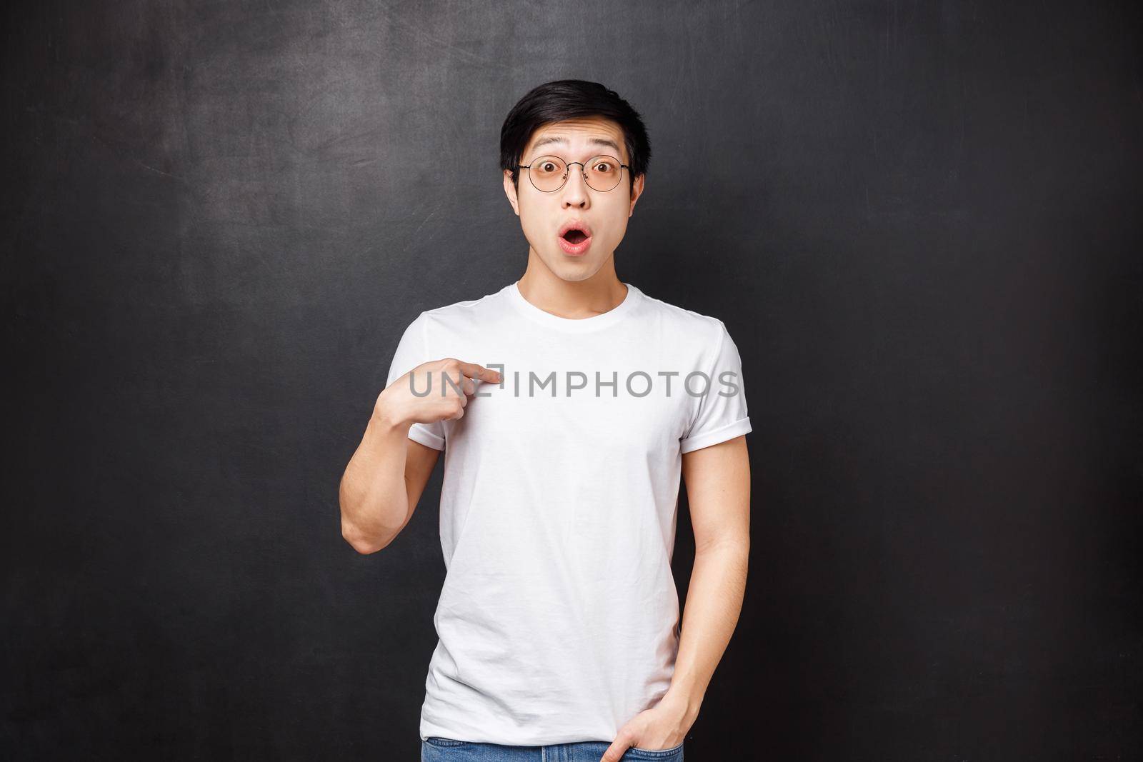 Portrait of surprised confused handsome asian guy being chosen or named, pointing himself with disbelief and amazement, didnt expect to be picked, standing amazed black background by Benzoix