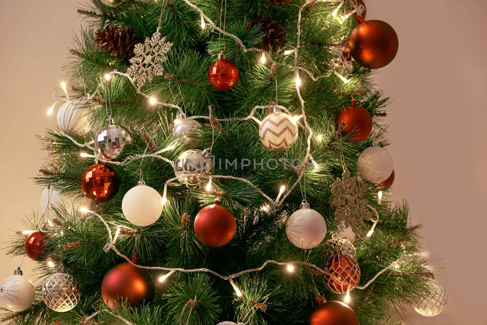 Decorated Christmas tree on blurred, sparkling and fairy background