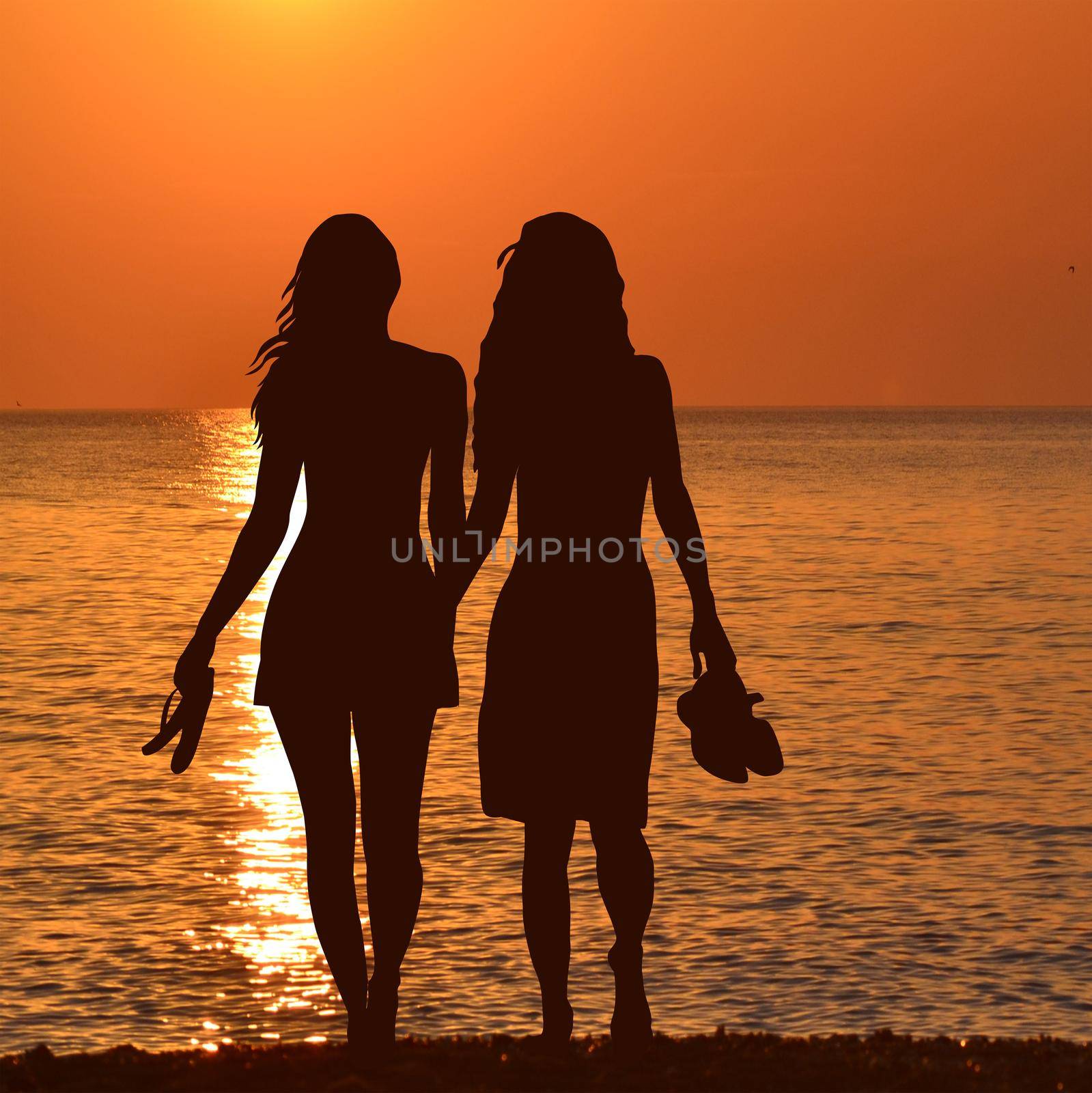 Silhouette of two lesbian girls on the beach in sunrise