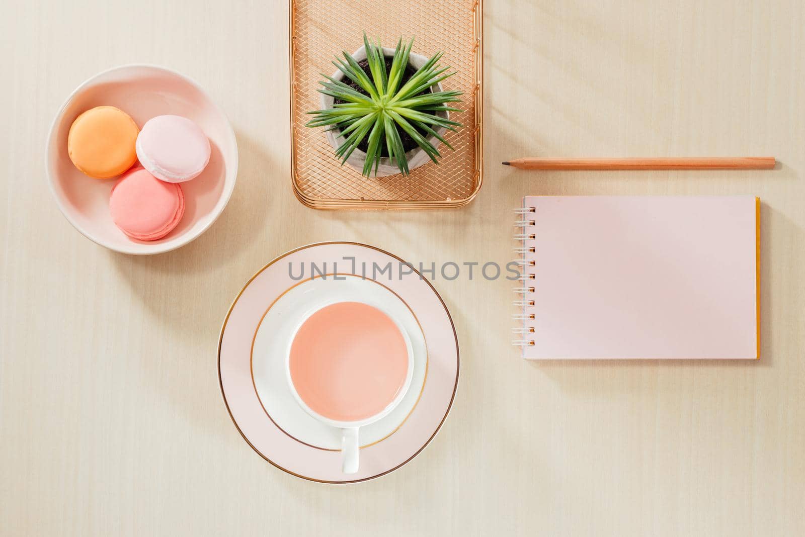 Styled stock photography beige office desk table with blank notebook, macaroon, supplies and coffee cup