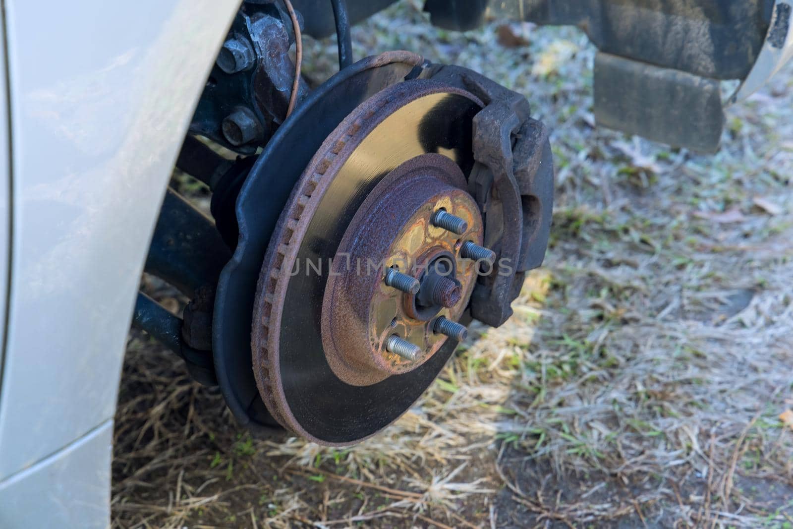 Mechanic change the old drive to the new brake disc on car by ungvar