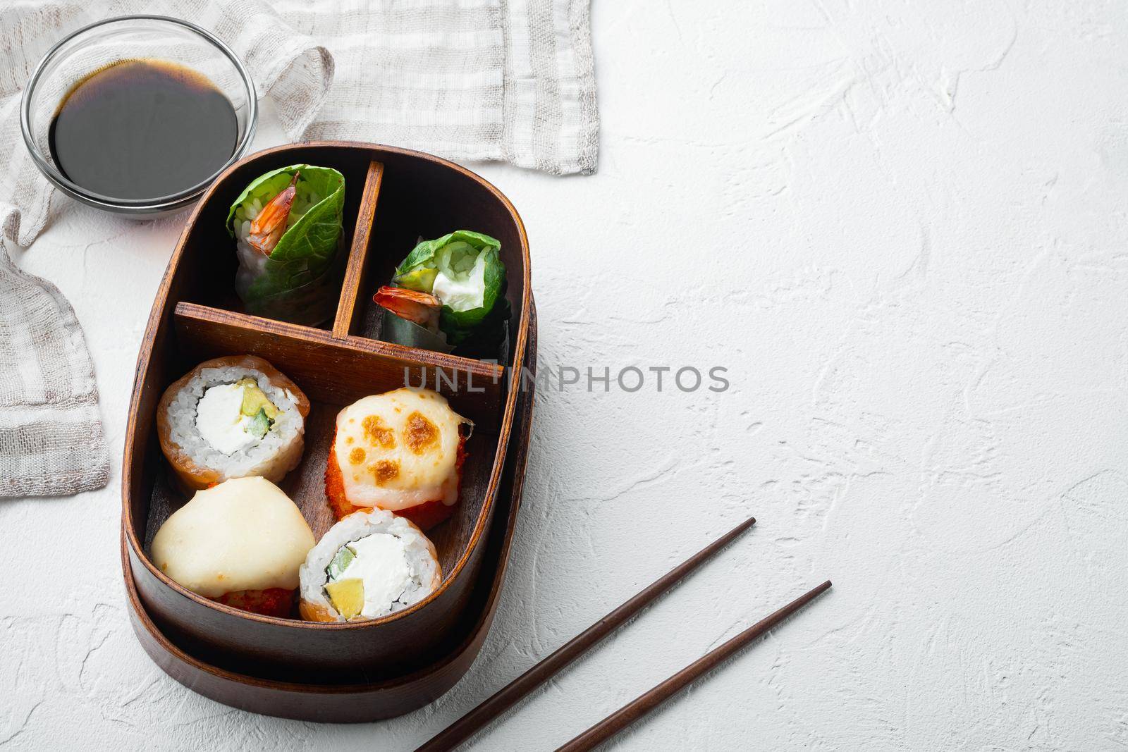 Japanese bento lunch box with chopsticks set, on white stone background , with copyspace and space for text