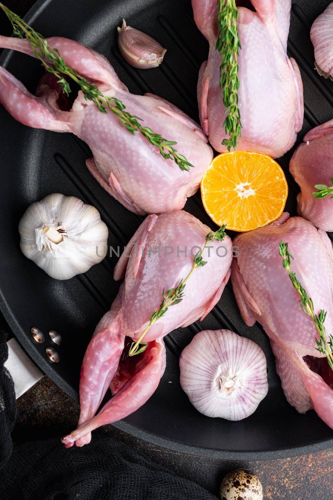 Homemade eco friendly raw quails, top view, on old rustic background by Ilianesolenyi