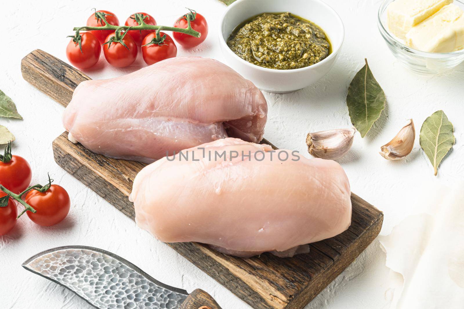 Chicken kiev ingredients with filo set, on white stone background