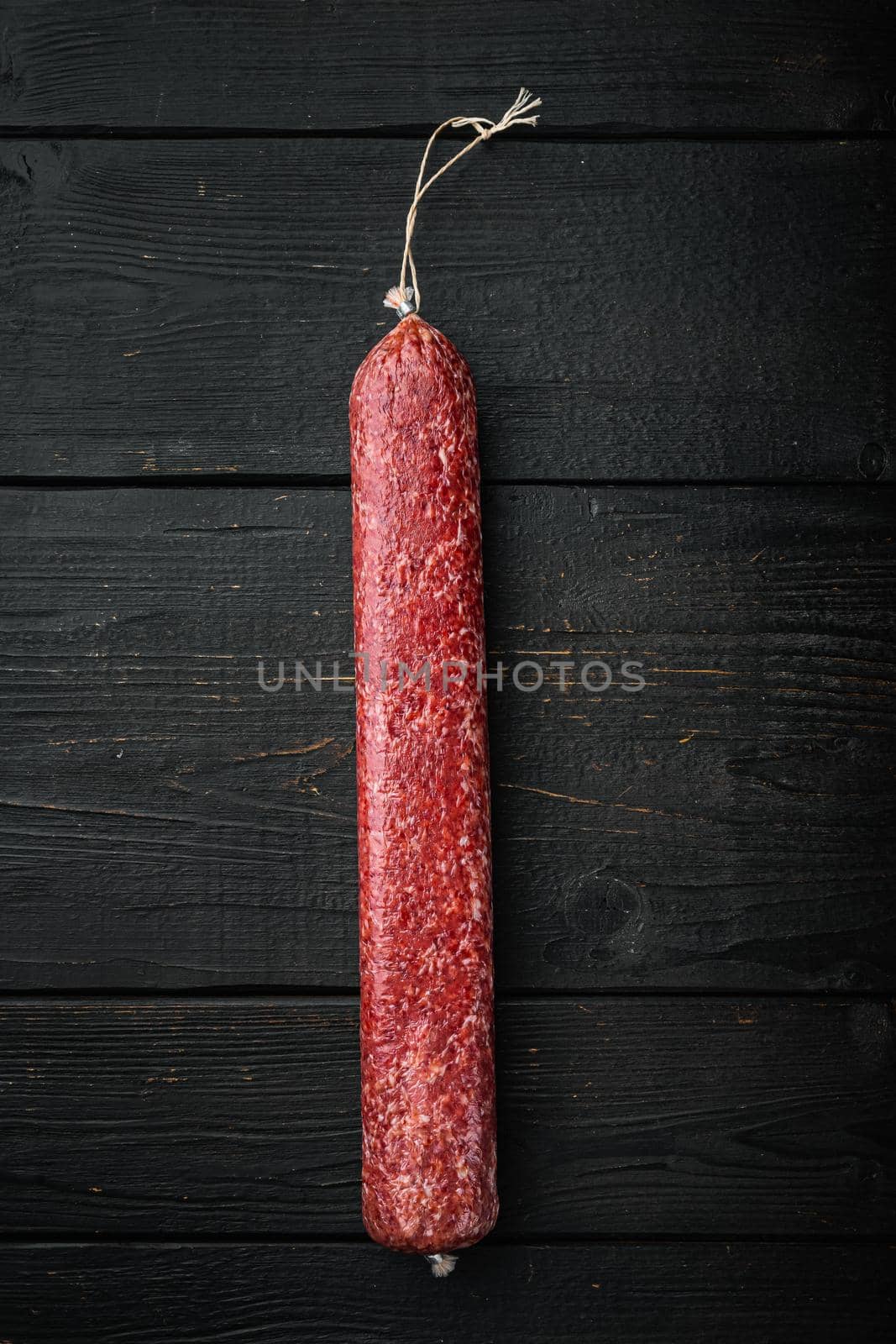 Delicious sausage, on black wooden table background, top view flat lay, with copy space for text by Ilianesolenyi