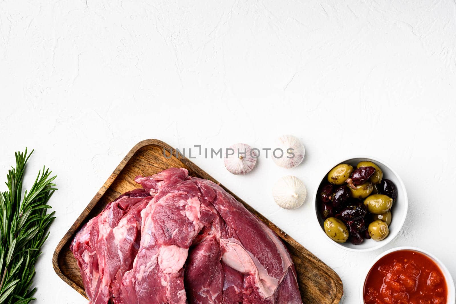 Lamb meat fresh raw set, with ingredients and herbs, on white stone table background, top view flat lay, with copy space for text