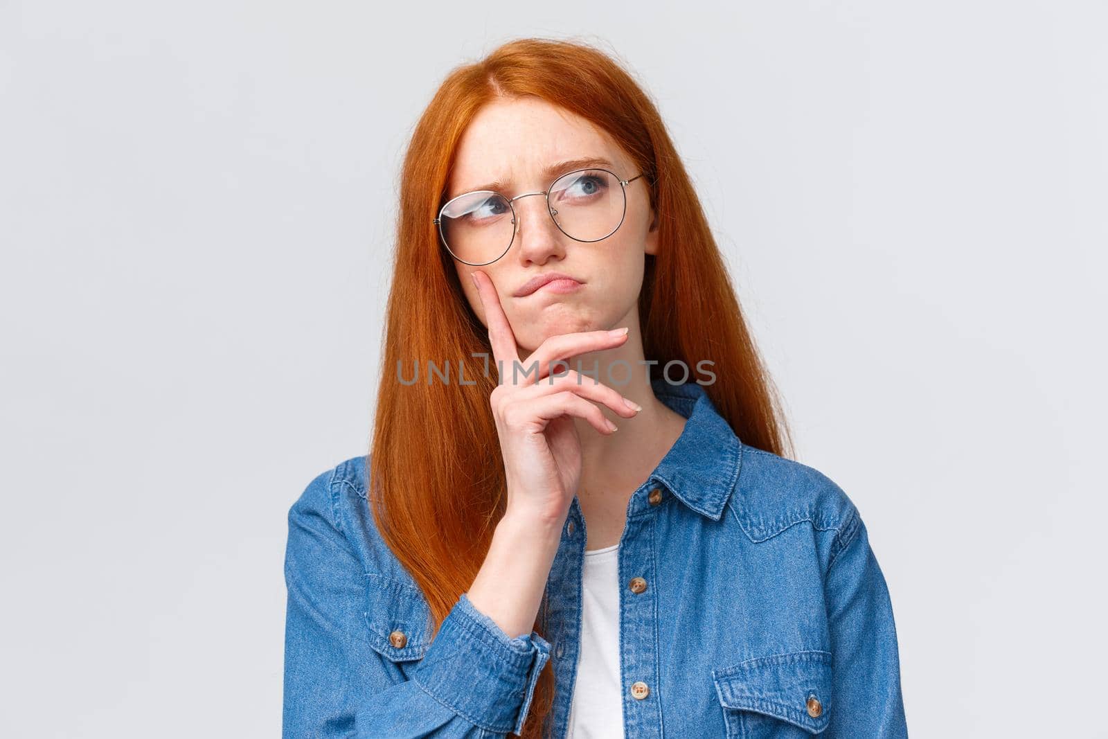 Close-up thoughtful and focused, creative female freelancer, student want work part-time, thinking opportunities, look away smirk and frowning pondering, make decision, stand white background.