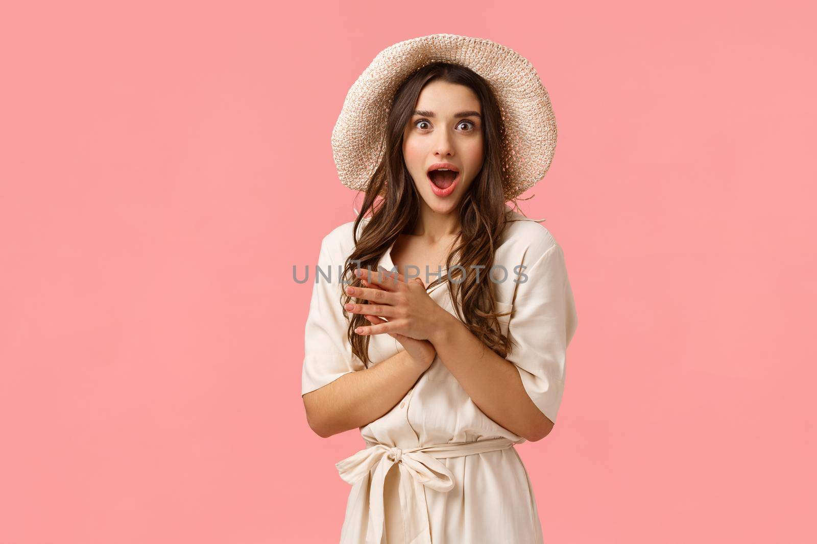 Wow amazing, wonderful news, congratulations. Intrigued and excited cheerful caucasian brunette in dress and stylish hat, clap hands, applause amazed, seeing great performance, pink background by Benzoix