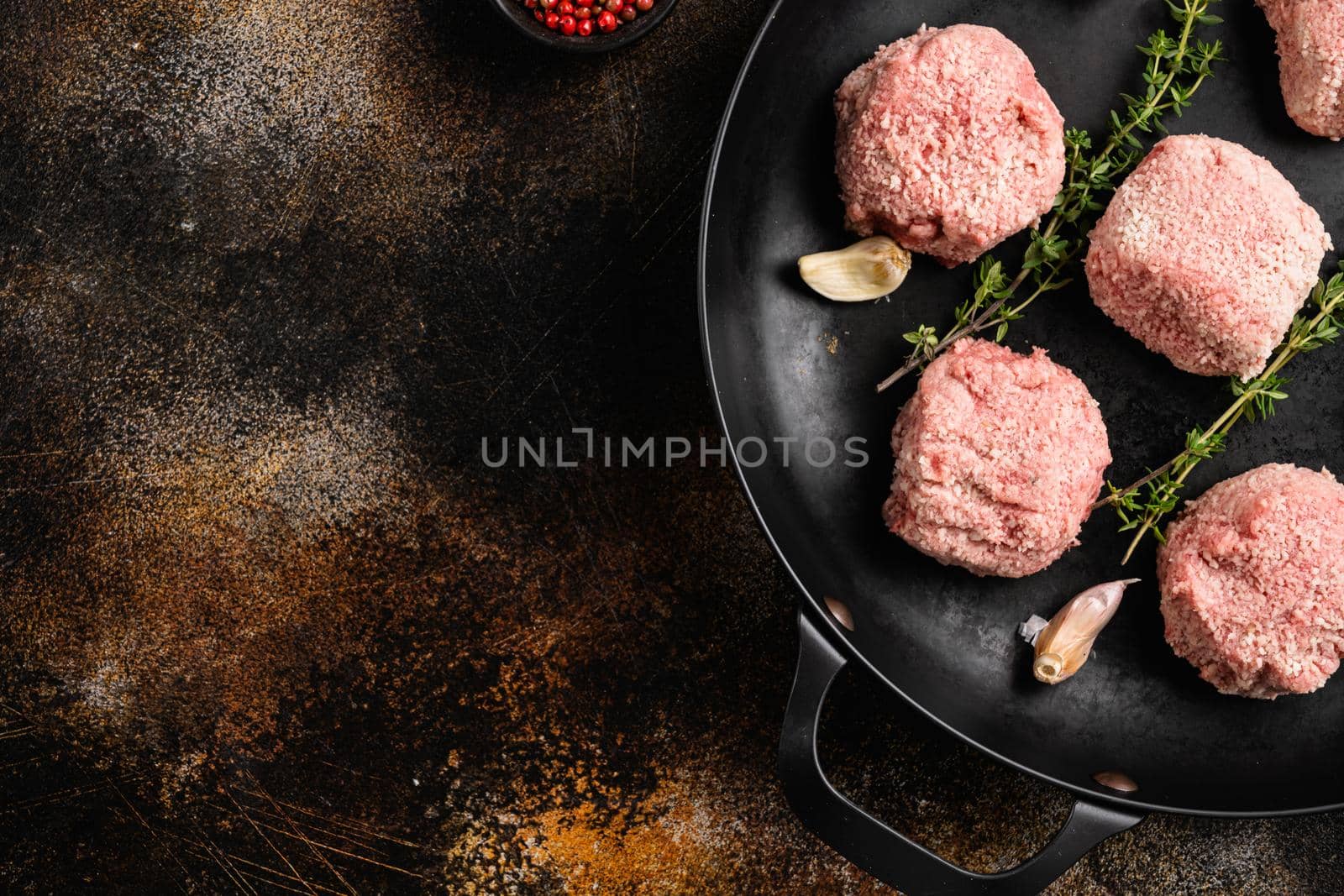 Organic minced meat meatball set, on old dark rustic table background, top view flat lay, with copy space for text