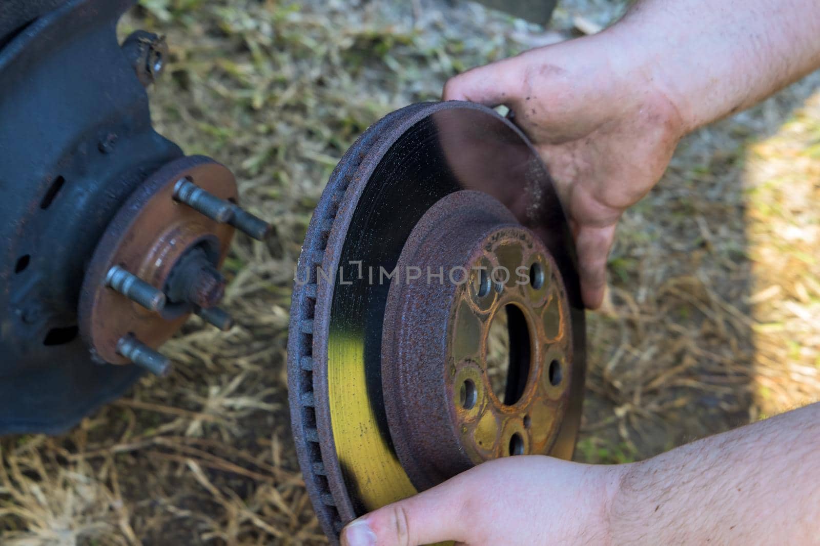 Replacing Brake disc car pad with car mechanic repair service by ungvar