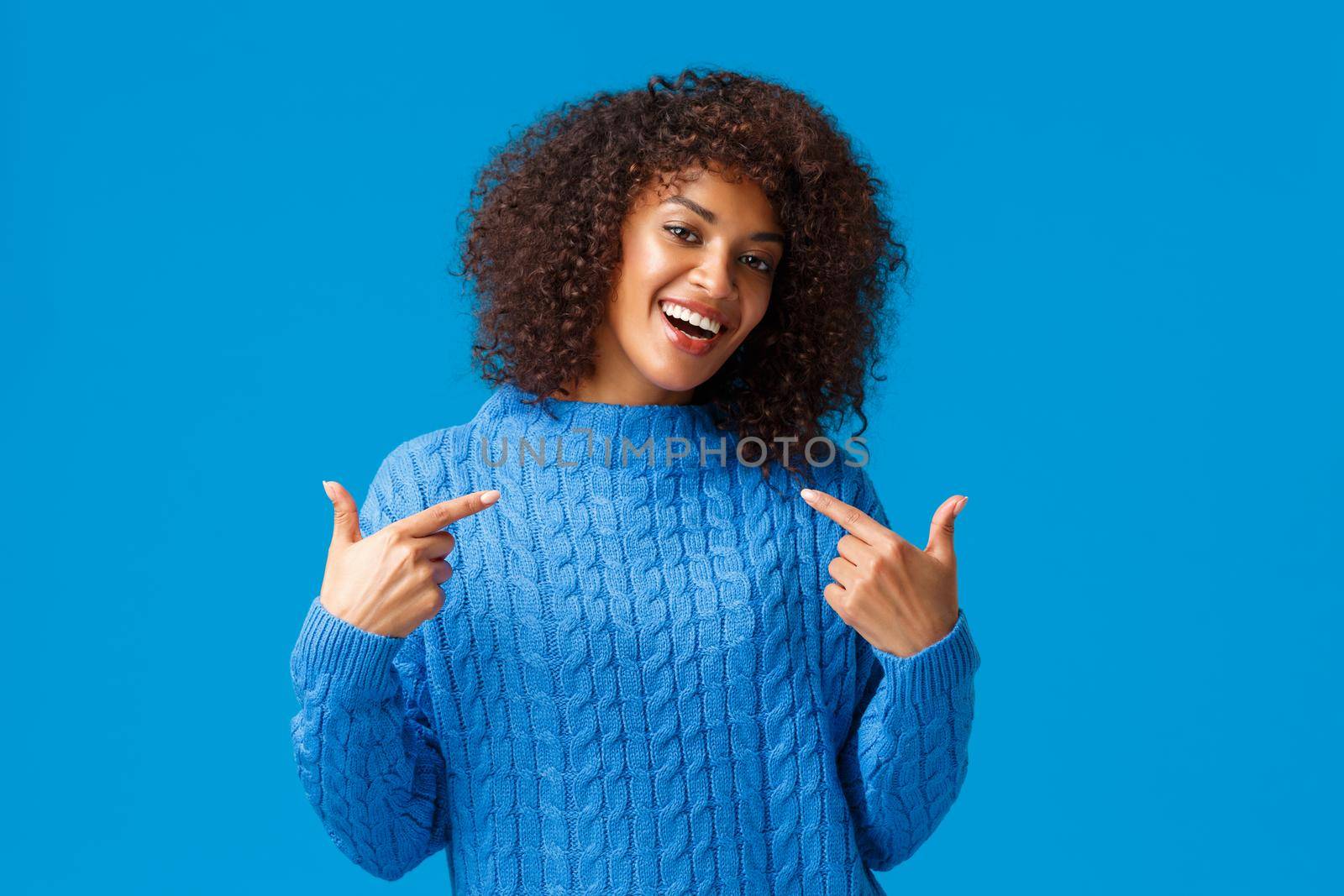 Girl got job, bragging and pointing herself boastful. Proud good-looking african american female in winter sweater, talking personal achievement and smiling satisfied, won prize become champion by Benzoix