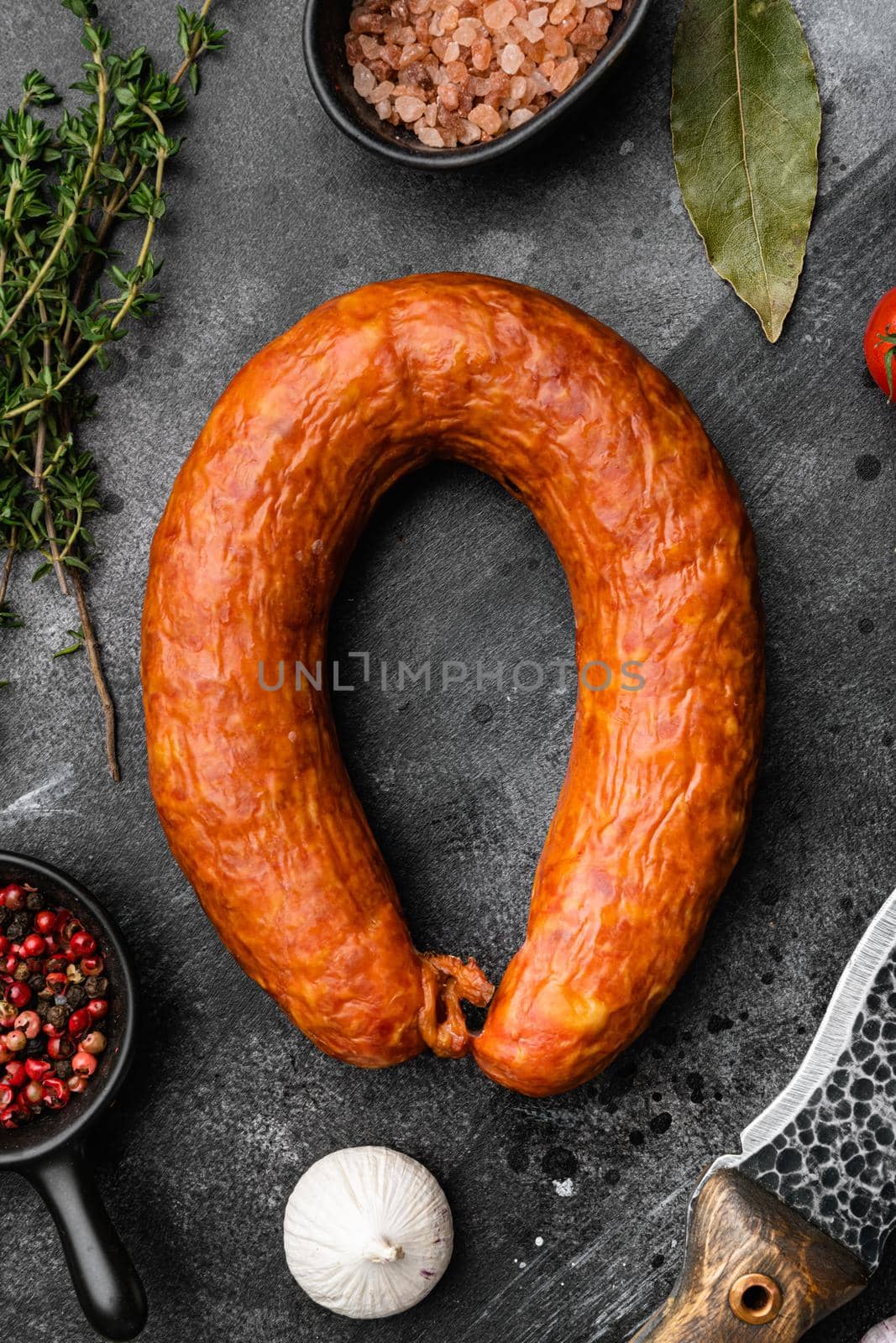 Sausage, on black dark stone table background, top view flat lay by Ilianesolenyi