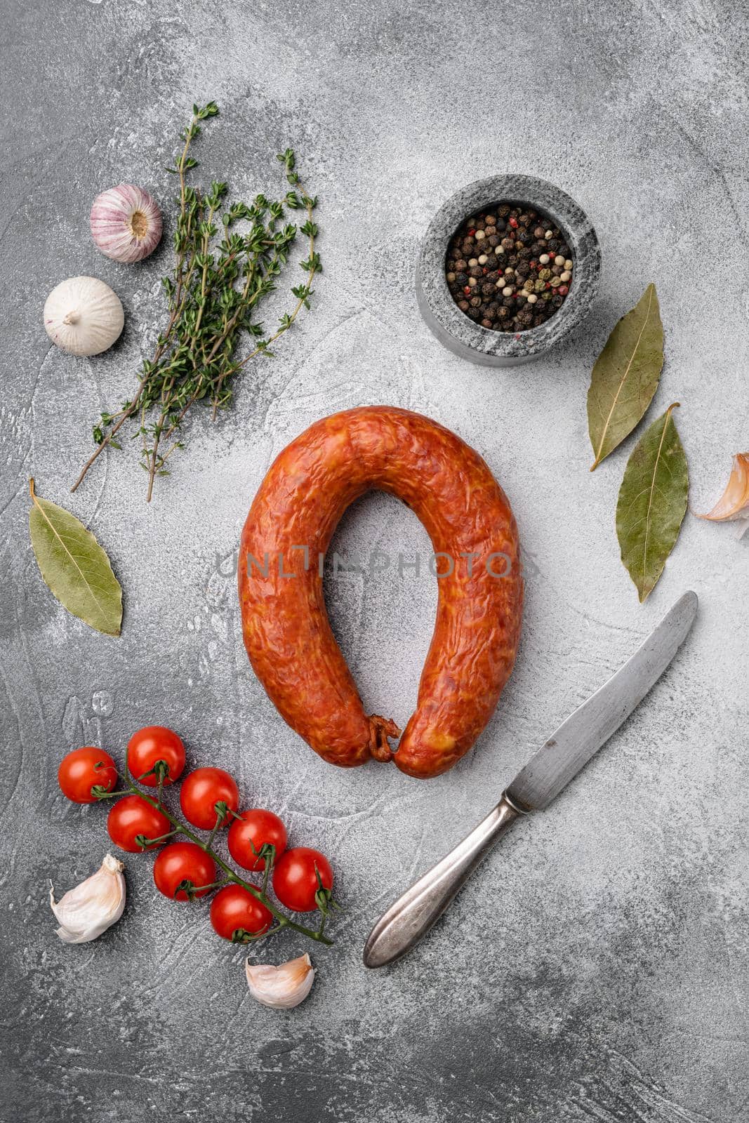 Smoked wurst, on gray stone table background, top view flat lay by Ilianesolenyi