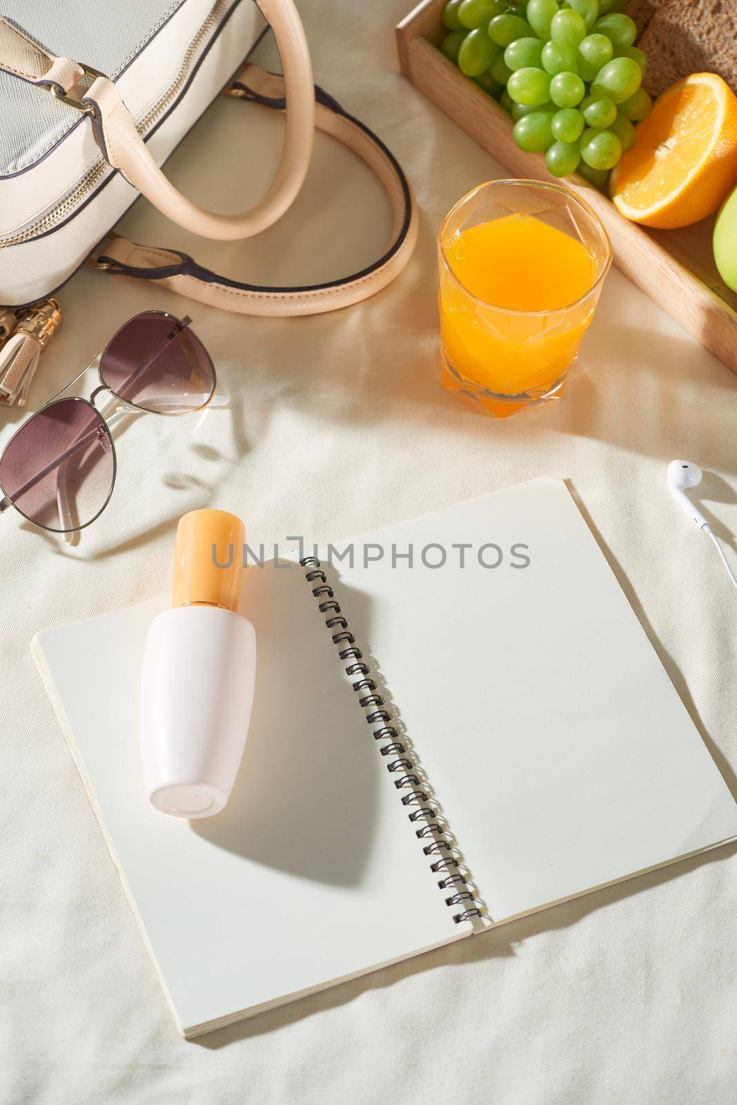 Summer holiday with bag, fruit, sun cream, glasses, accessories on white background