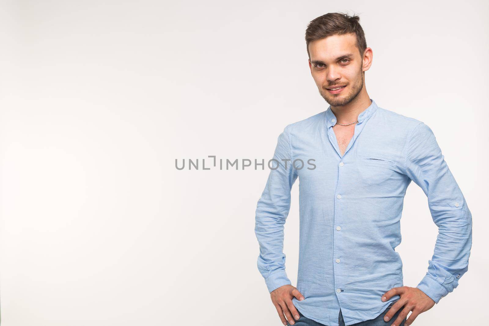 Self-confidence, business and people concept - Successful handsome man with smile on white background with copy space.