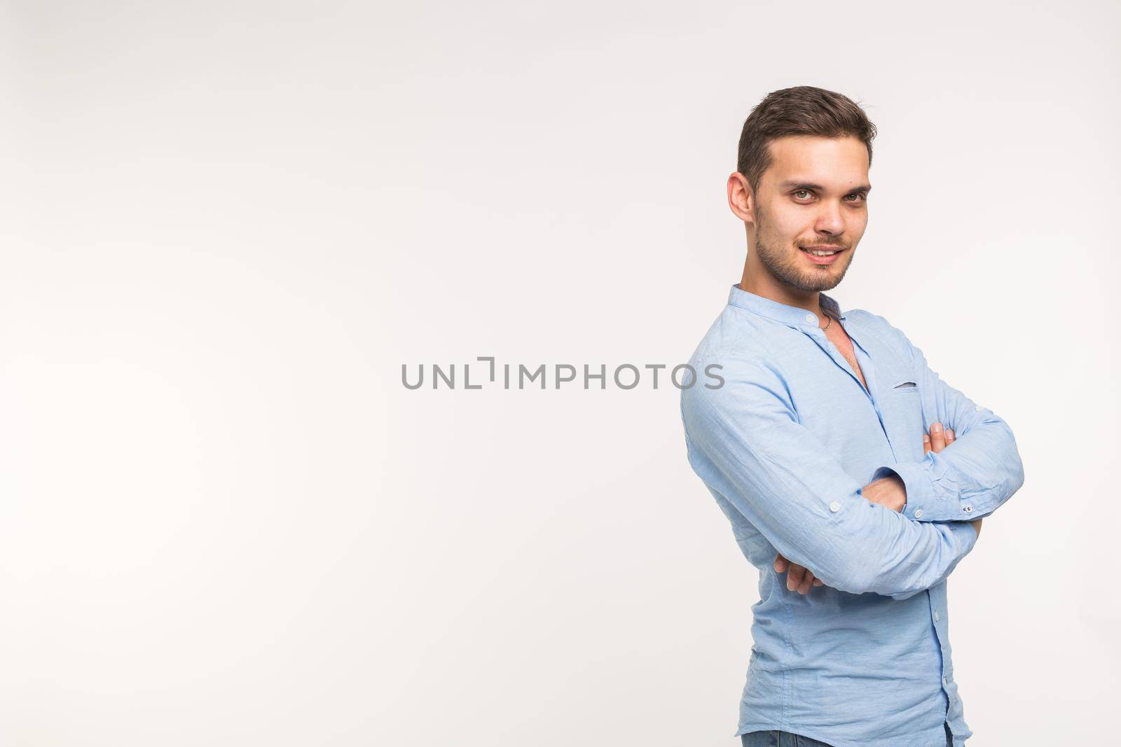 Self-confidence, business and people concept - Successful handsome man with smile on white background with copy space.