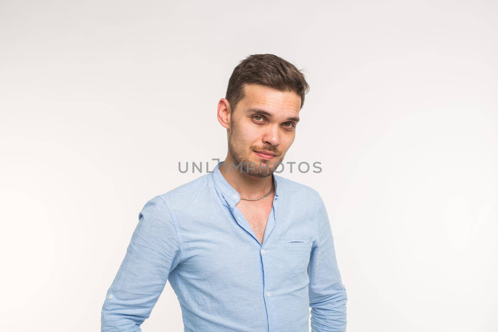 Self-confidence, business and people concept - Successful handsome man with smile on white background with copy space.