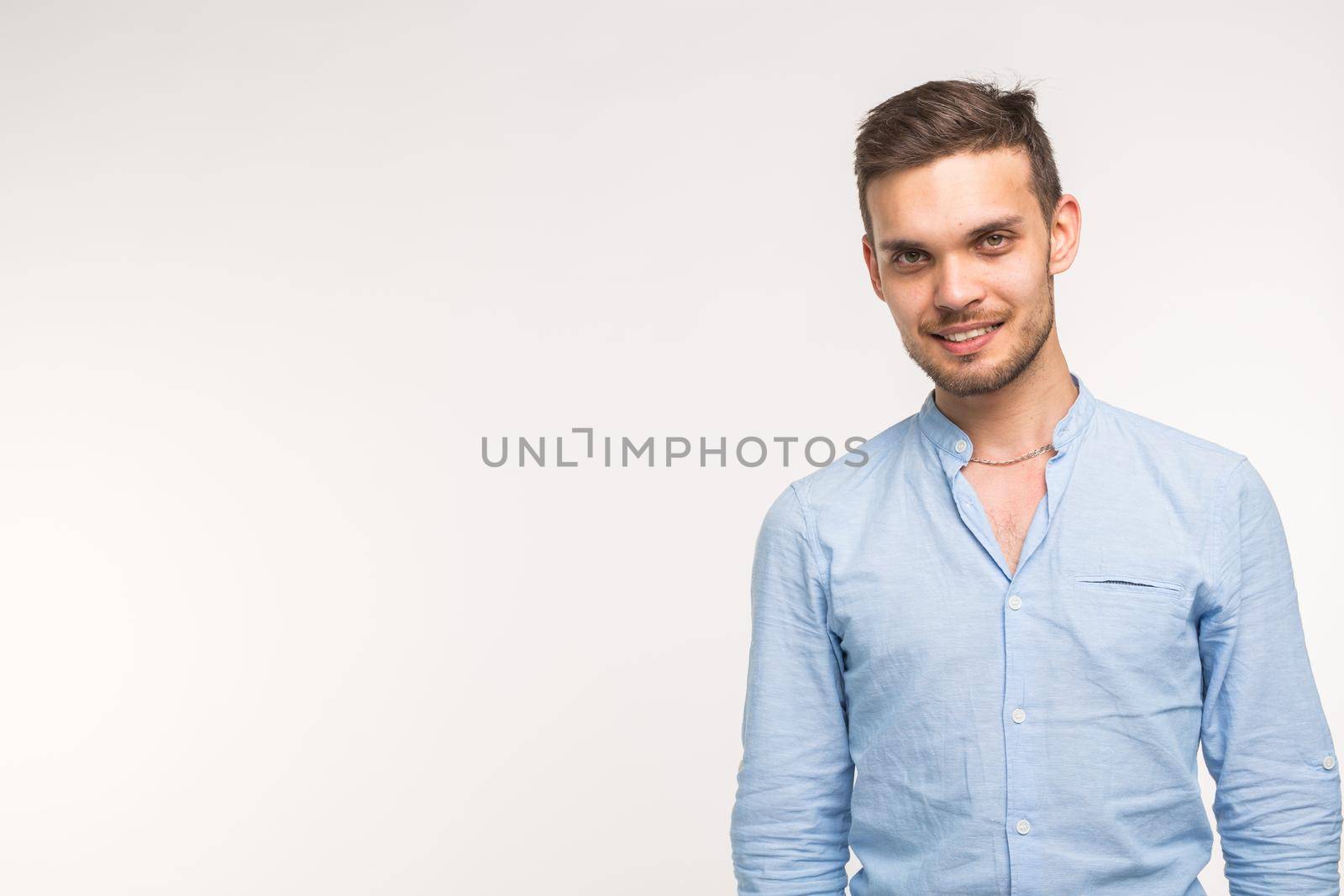 Self-confidence, business and people concept - Successful handsome man with smile on white background with copy space.