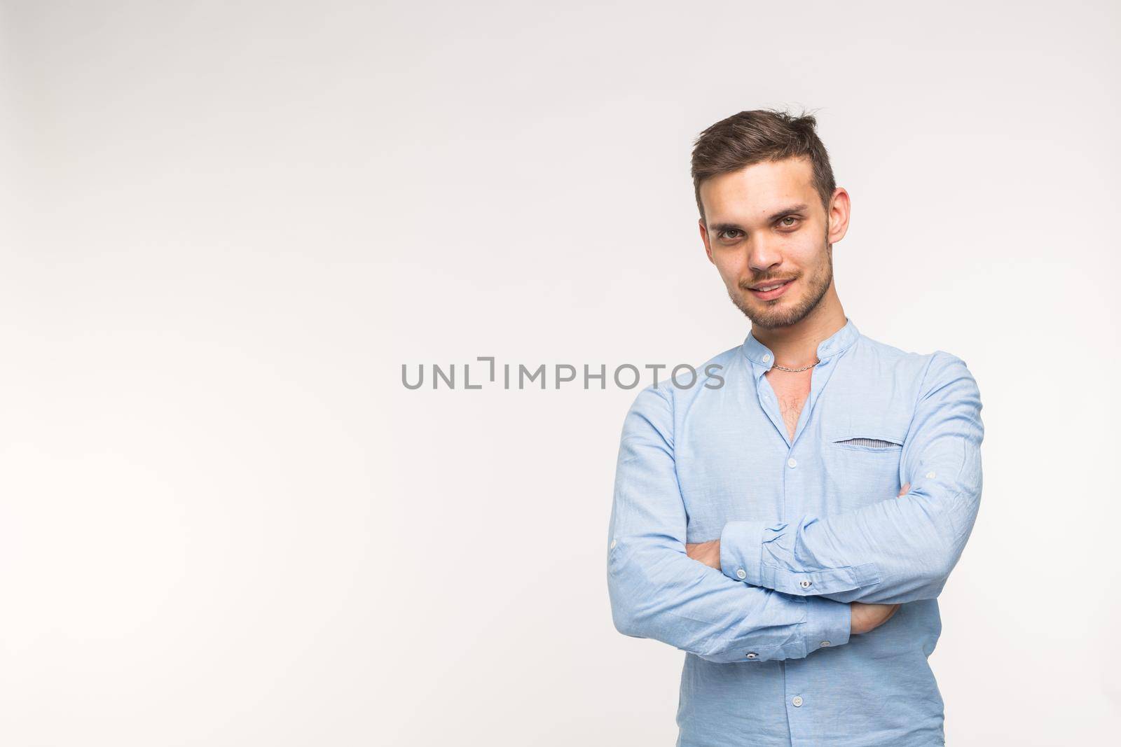 Self-confidence, business and people concept - Successful handsome man with smile on white background with copy space.