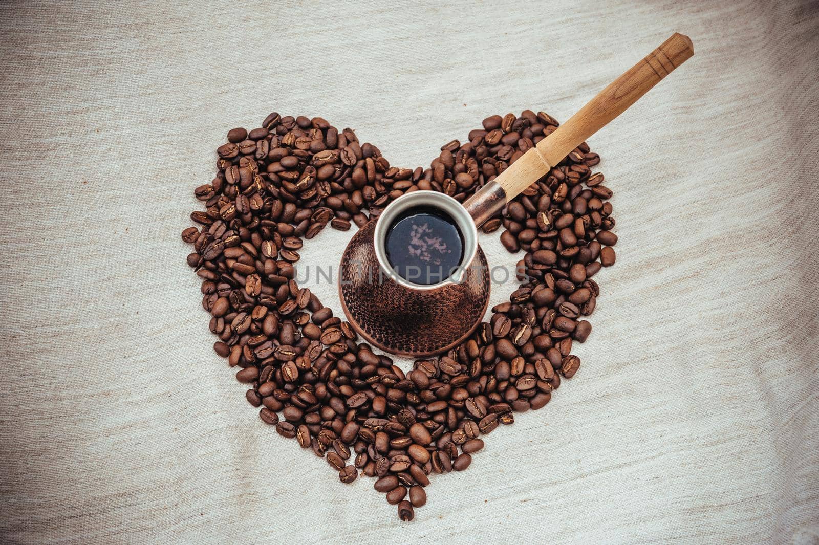 Coffee turk on burlap background. coffee beans isolated on white background. roasted coffee beans by Andrii_Ko