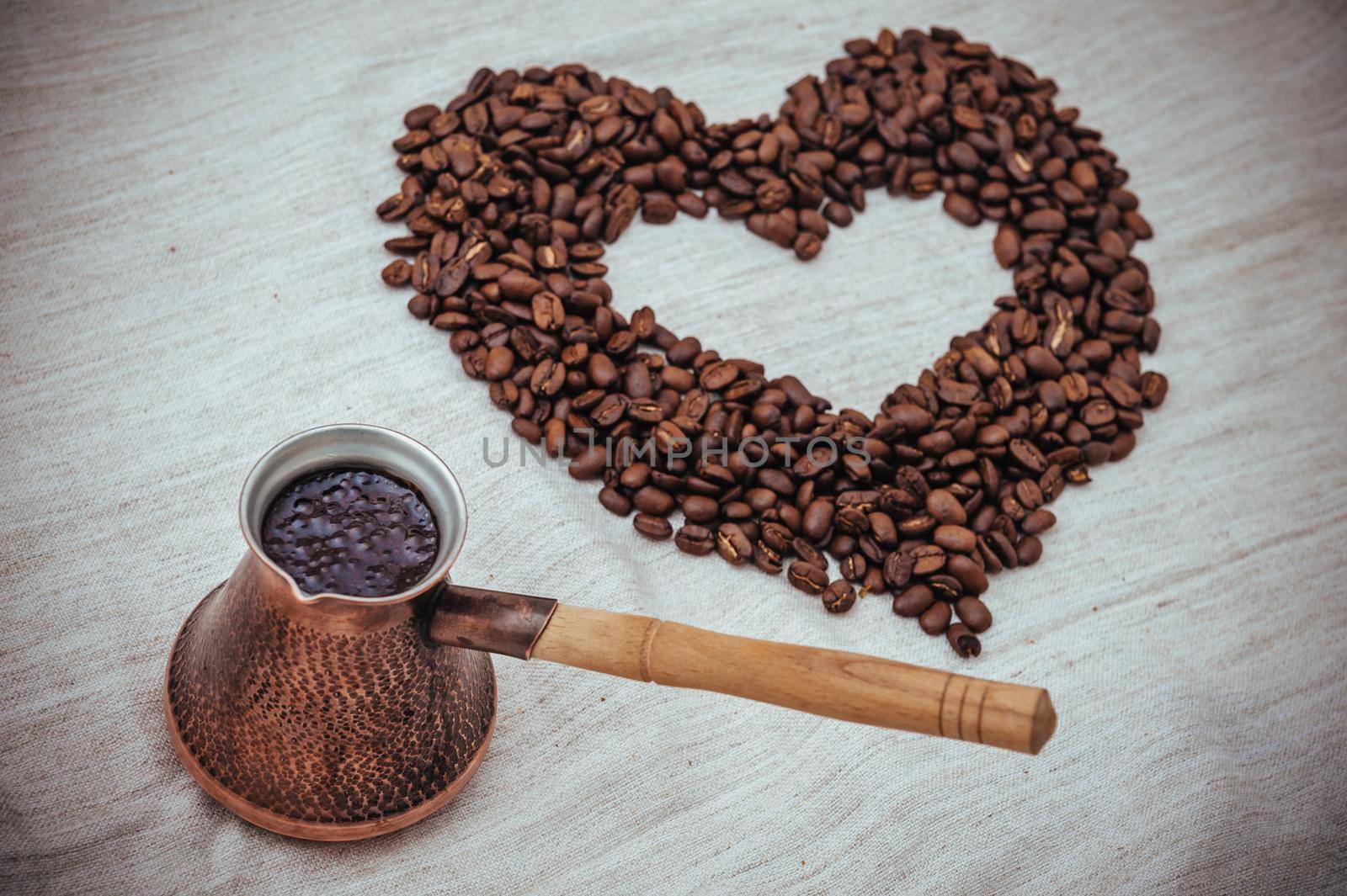 Coffee turk on burlap background. coffee beans isolated on white background. roasted coffee beans