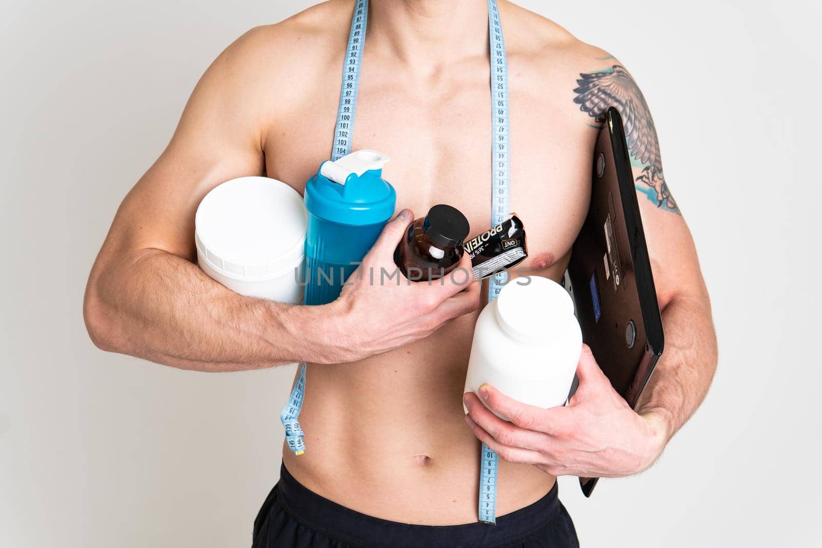 Fitness protein jars white on white background bodybuilder powder strong high back hurt painful, cramp sick white background stress, muscular Touching neck therapy, problem suffer attractive by 89167702191