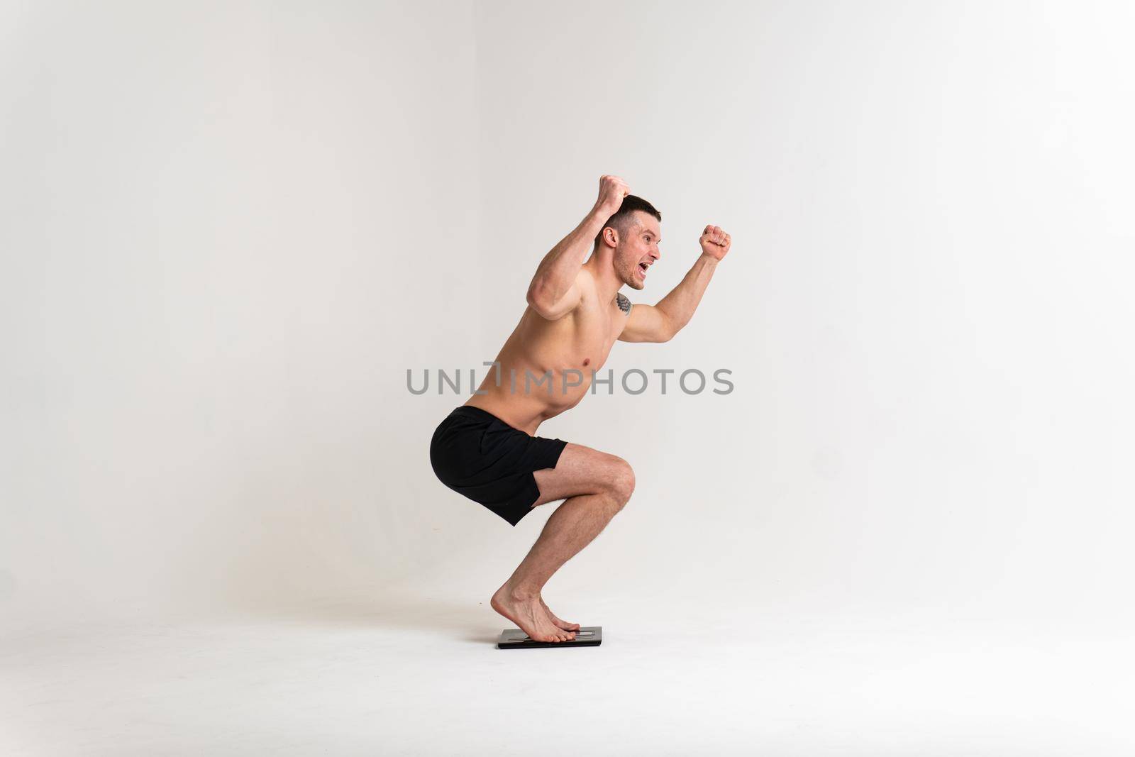 Man with weights health pondered, health and sports on a white background back hurt muscle, sick male medical, illness holding. Touching neck disease suffer attractive