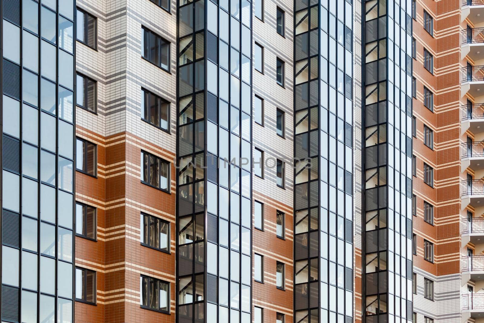 modern multi-family housing, residential building facade with aluminum windows.