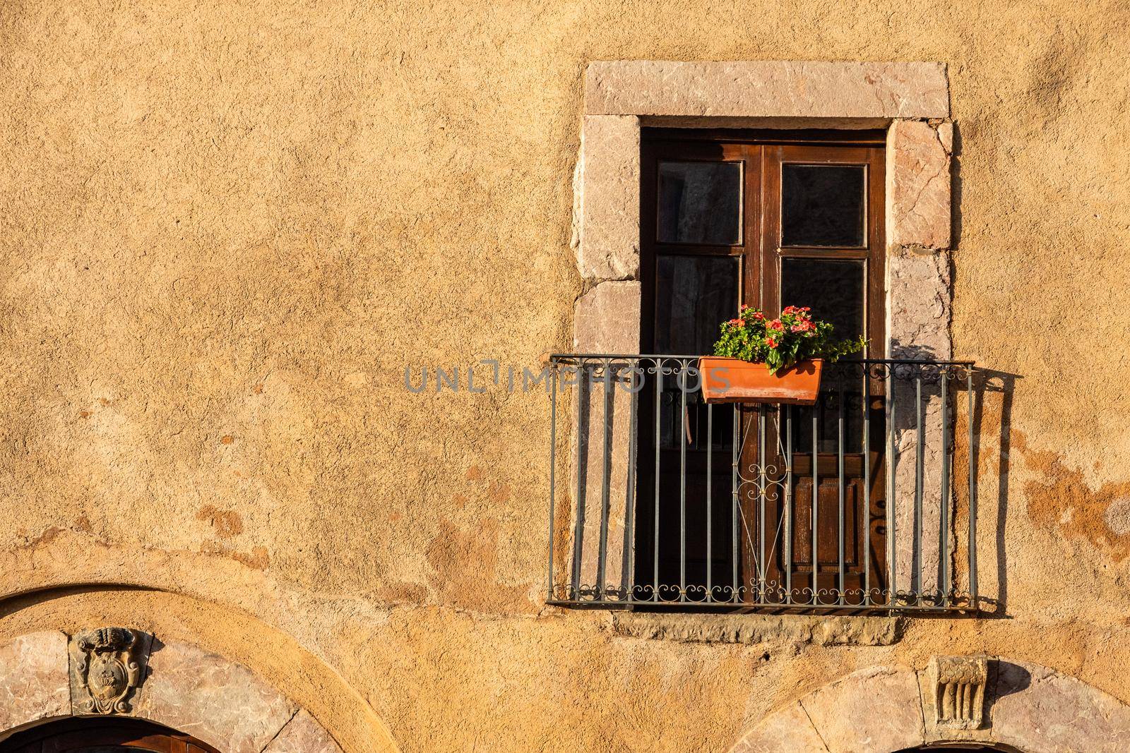 Balcony of an old house illuminated by the sun, Sicily, Italy by mauricallari