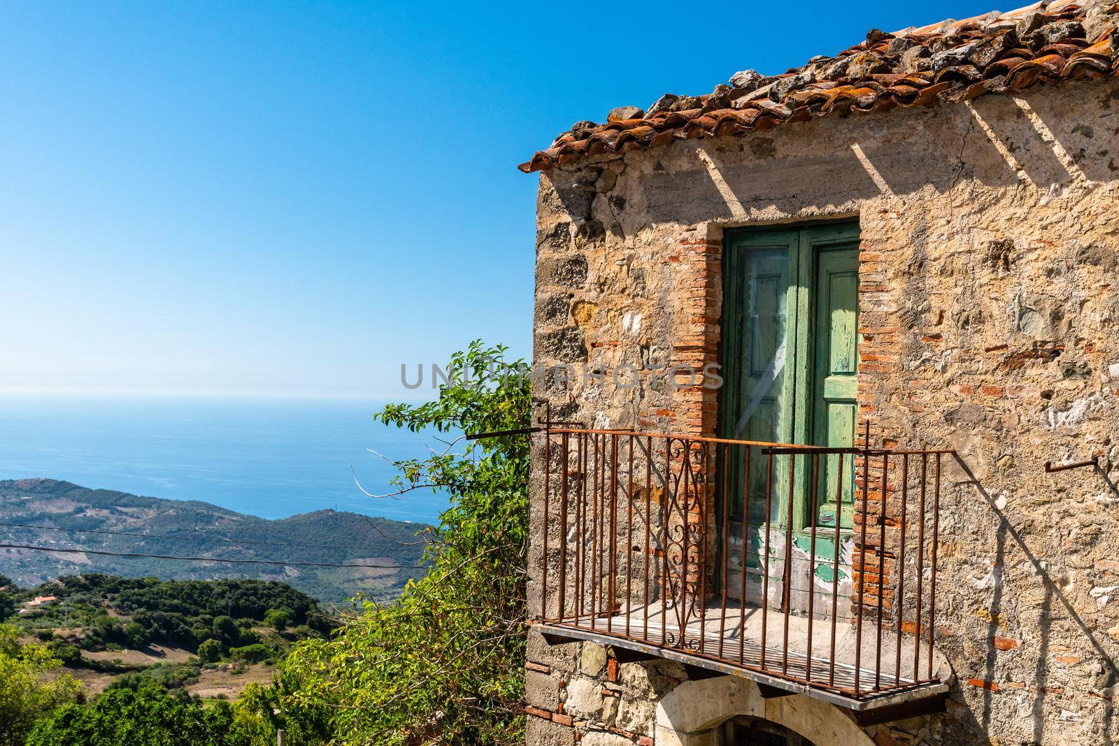 Balcony of an old house with view on the mediterranean sea, Sicily, Italy by mauricallari