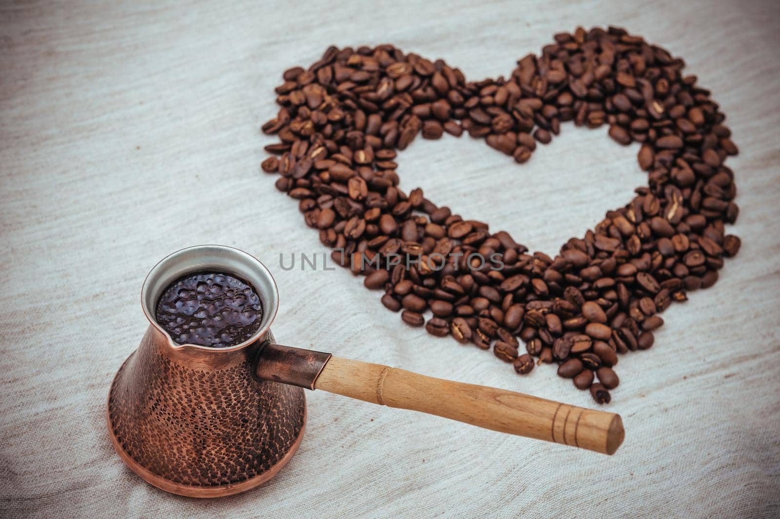 Coffee turk on burlap background. coffee beans isolated on white background. roasted coffee beans