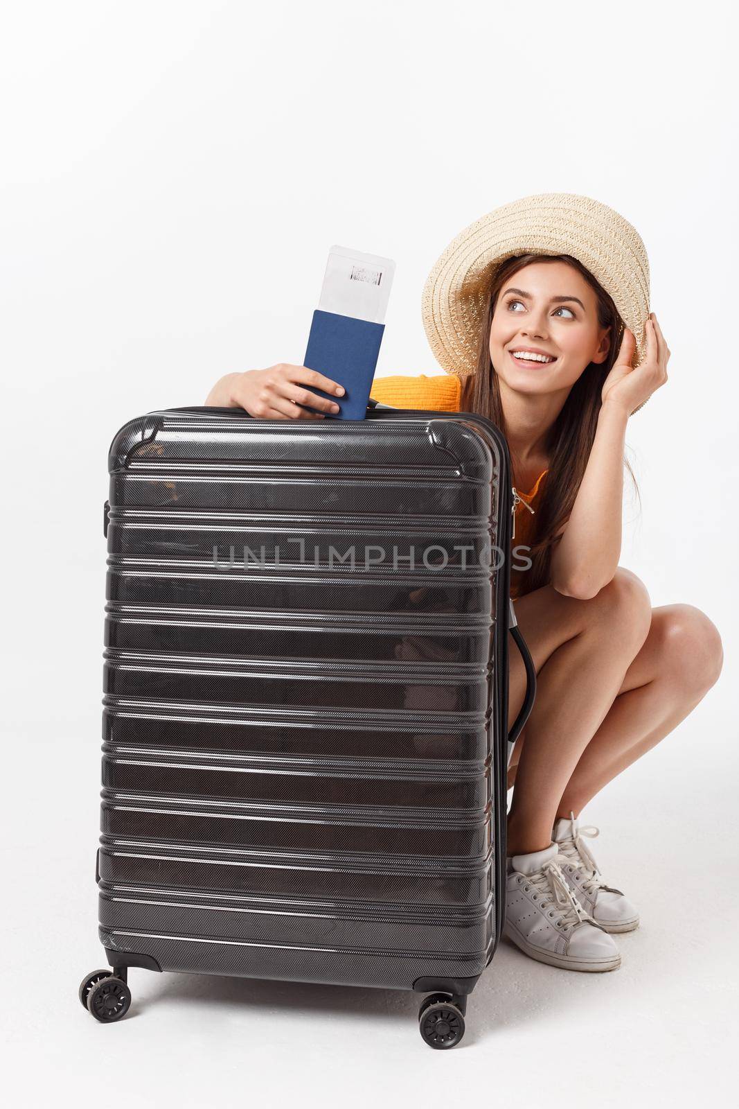 Full length of attractive young female in traveller casual with the travel bag, isolated on white background.