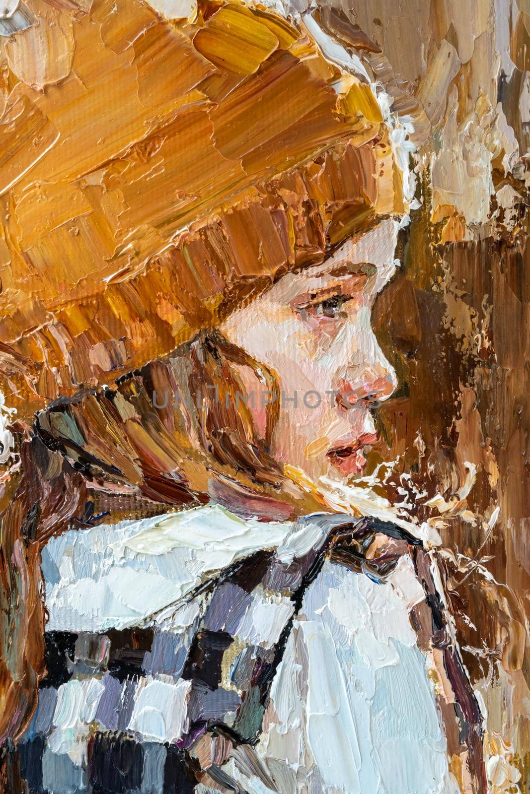 .The girl in the rays of the setting sun. Little girl in a cap on a warm background. Oil painting on canvas.