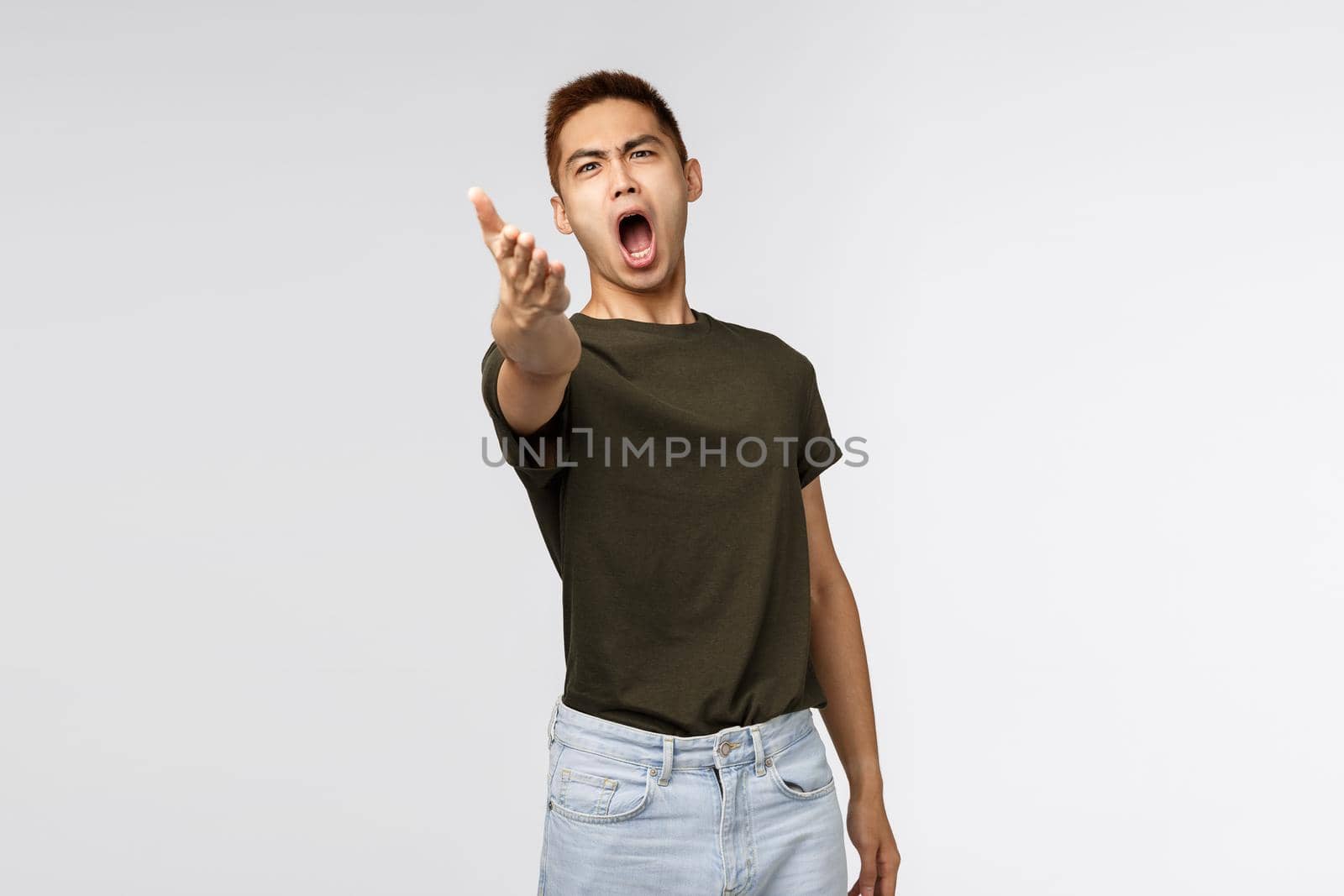 Portrait of pissed-off complaining, bothered asian man pointing with dismay at camera and accuse someone, look angry and outraged, blame person, judging bad behaviour, look at this mess by Benzoix