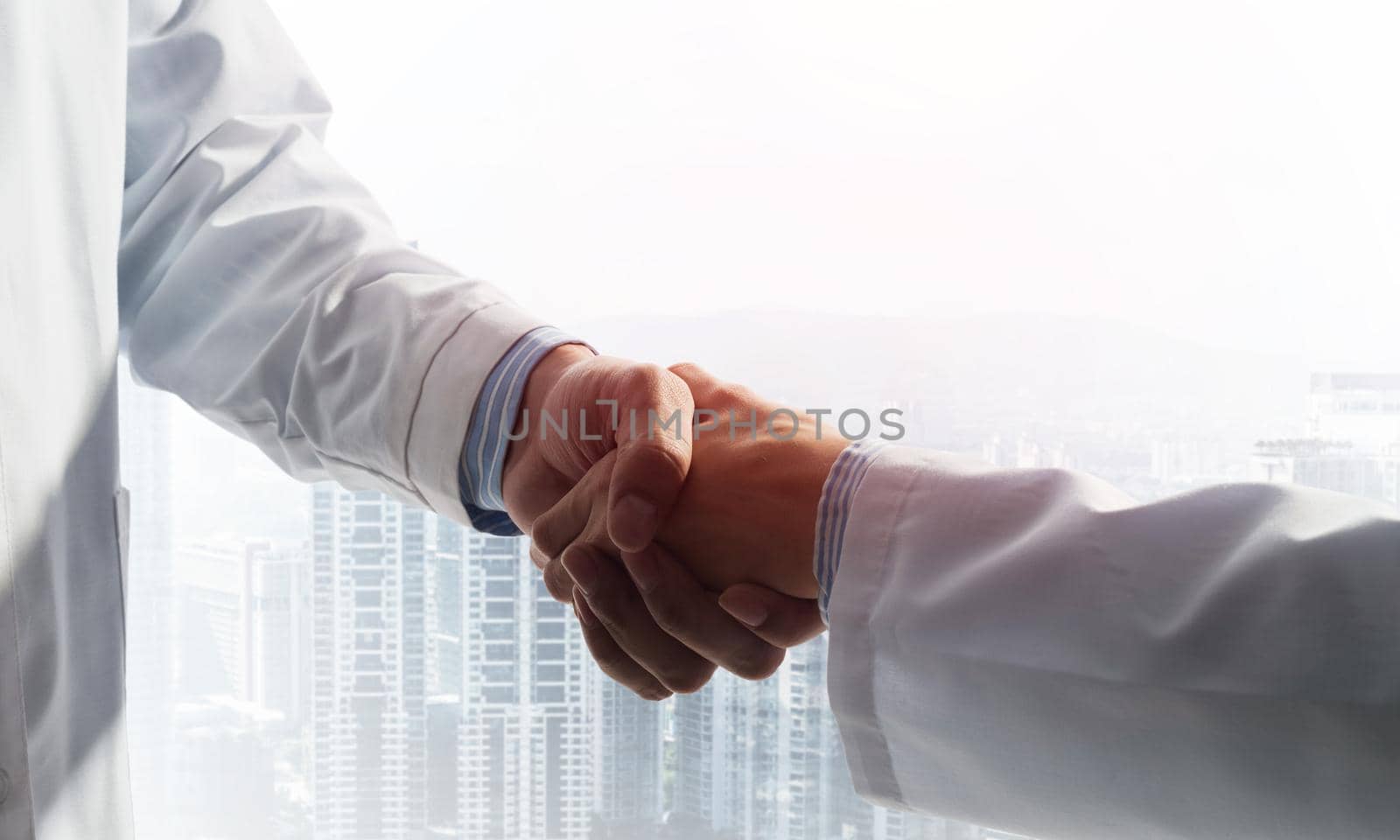 Close-up of the handshake between the two medics by adam121