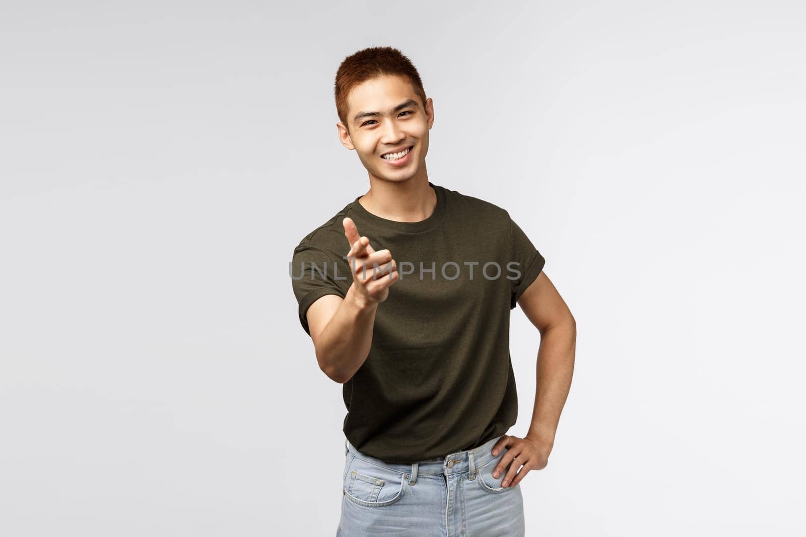 Nice work, good job. Portrait of young cheerful asian man pointing finger at camera and smiling satisfied, congratulate person with win, praise great choice, peeking or rectuiting for job.