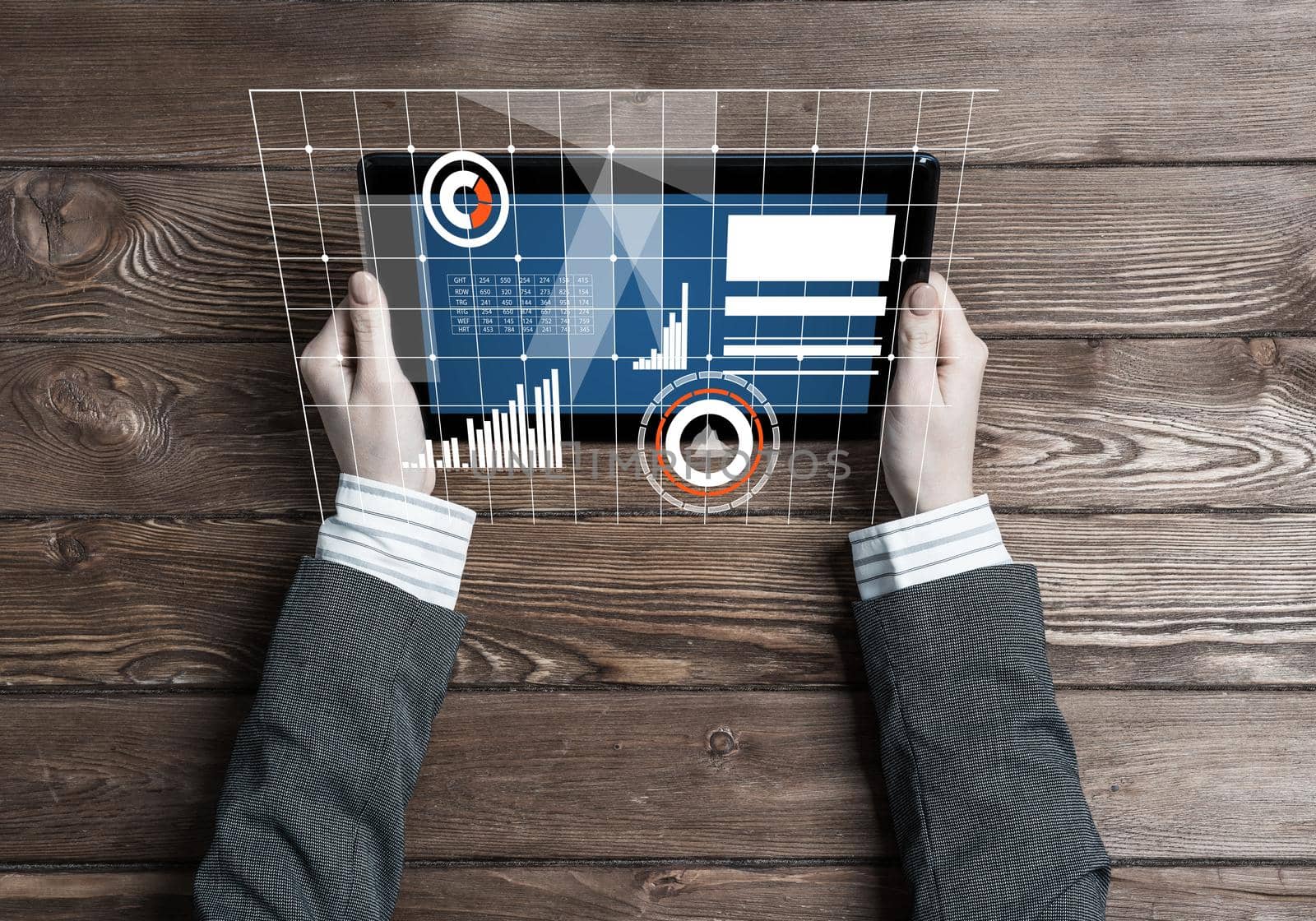 Business workplace with tablet device and media graphs and diagrams by adam121