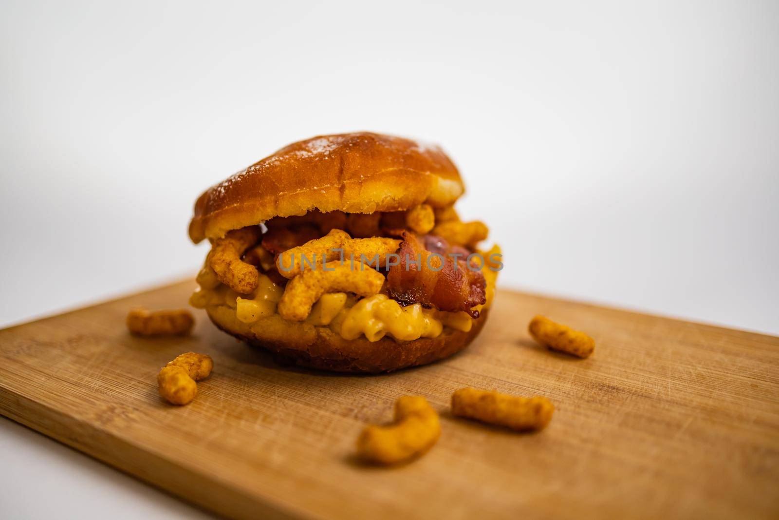 Dish for fat Thursday with big donut with mac and cheese bacon and peanut crisps by Wierzchu