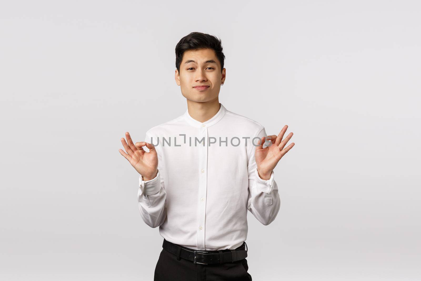 Neat, that was amazing. Impressed and proud sassy, arrogant asian businessman bragging personal achievement, showing alright, all is good gesture, smirk pleased, white background.