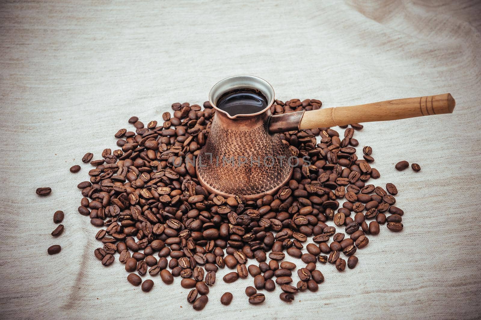 Coffee turk on burlap background. coffee beans isolated on white background. roasted coffee beans by Andrii_Ko