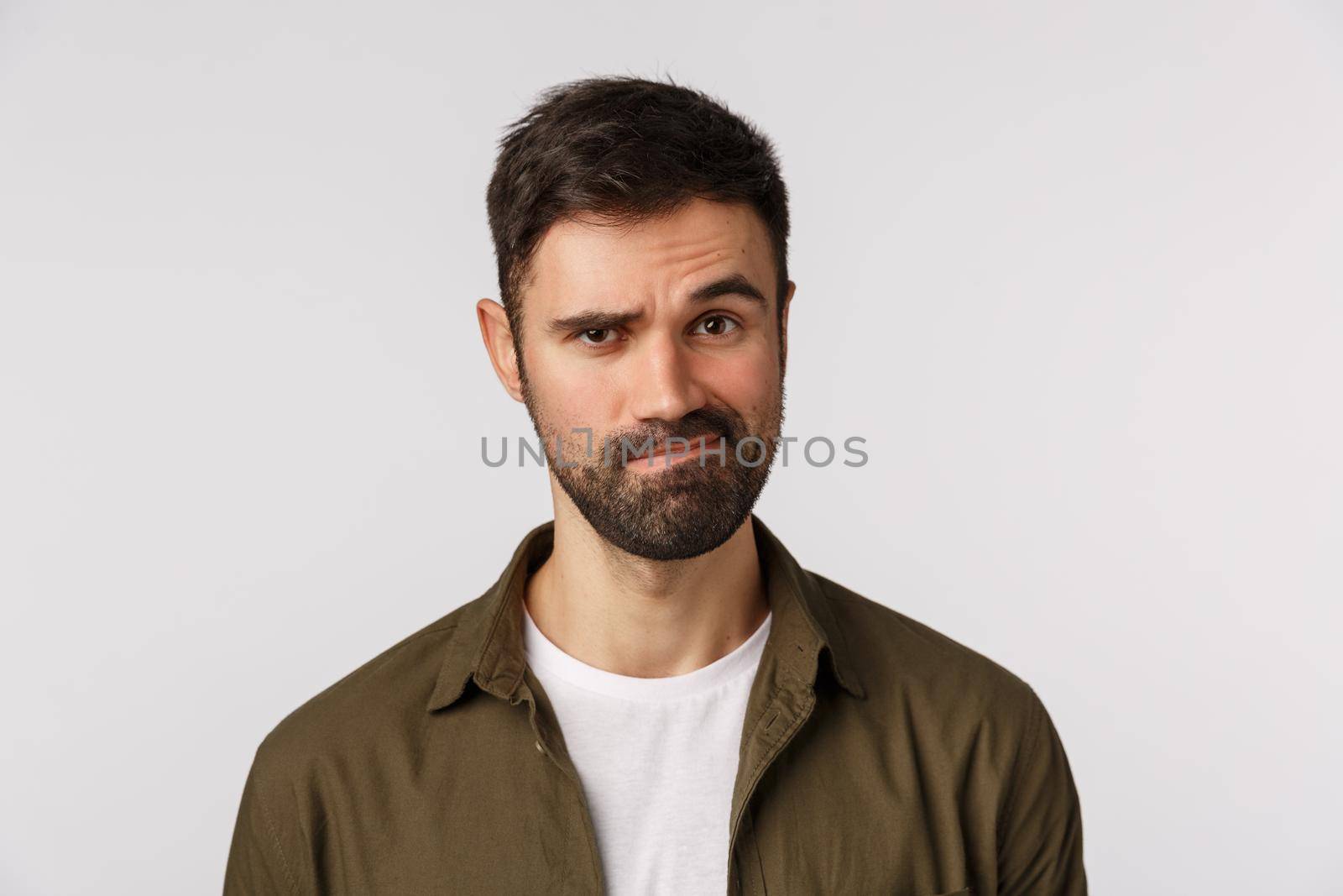 Skeptical and judgemental father hear strange proposal, look slightly unsatisfied and perplexed give answer, smirk and frowning displeased, pondering, judging uncool action, white background.