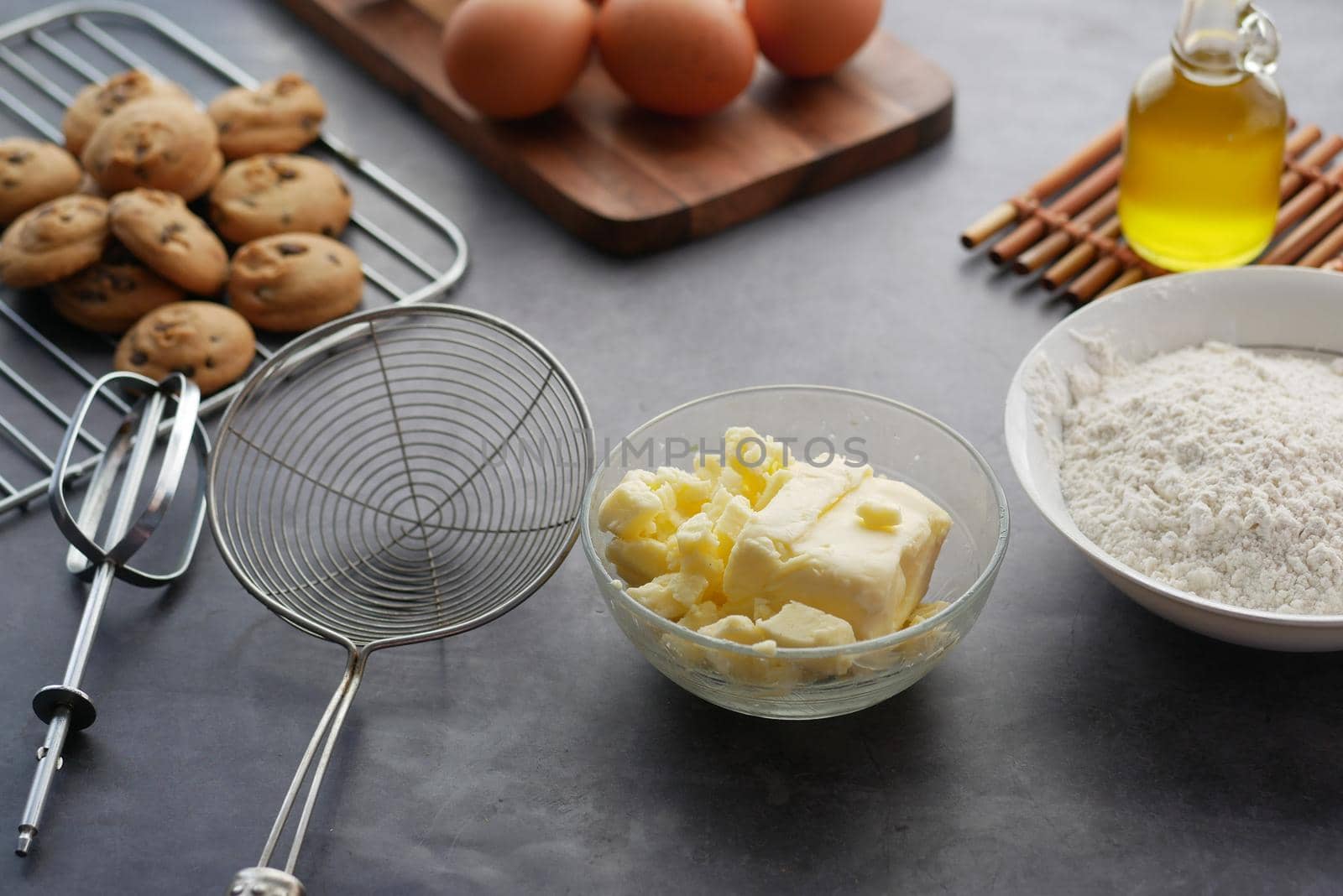 chicken eggs and baking ingredients on a wooden board,
