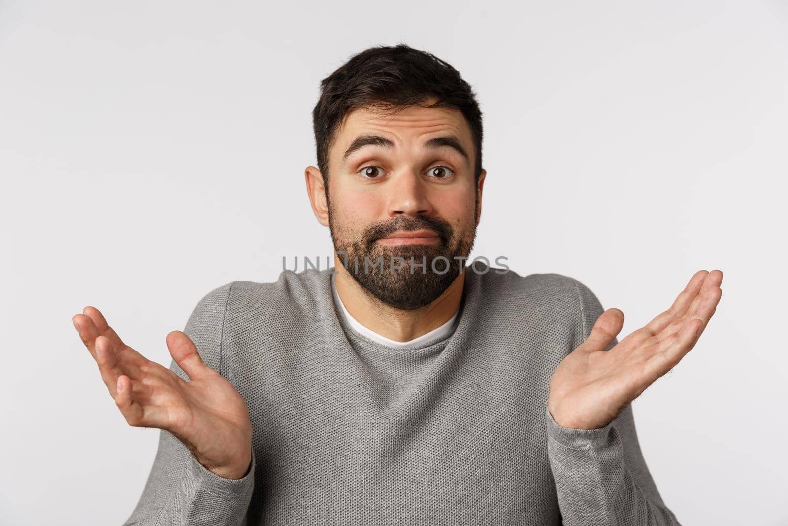 Im not involved, sorry cant help. Unaware and clueless cute young bearded father, avoid answering question, shrugging spread hands sideways, smirk uncertain and puzzled, standing white background by Benzoix